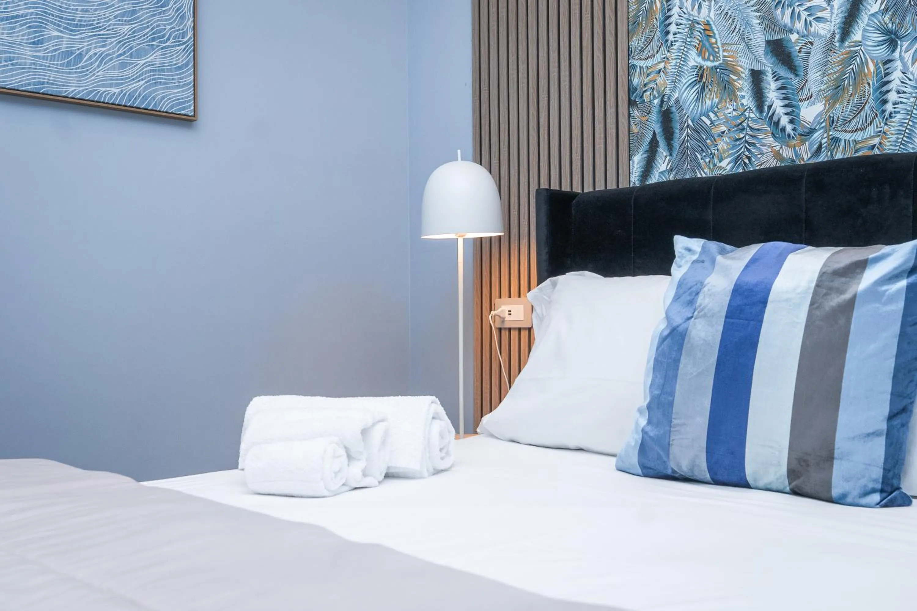 Bed in Noah Gate Hotel & Suites