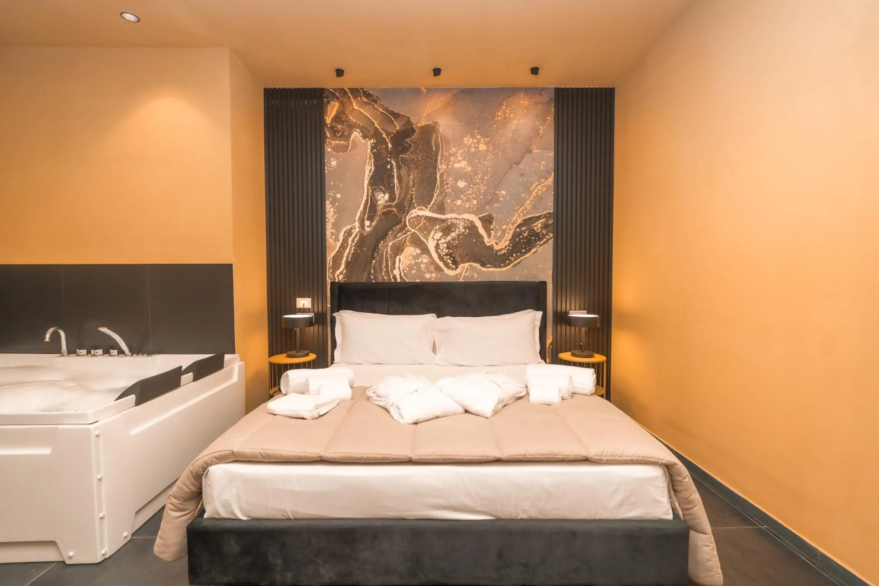 Bed in Noah Gate Hotel & Suites
