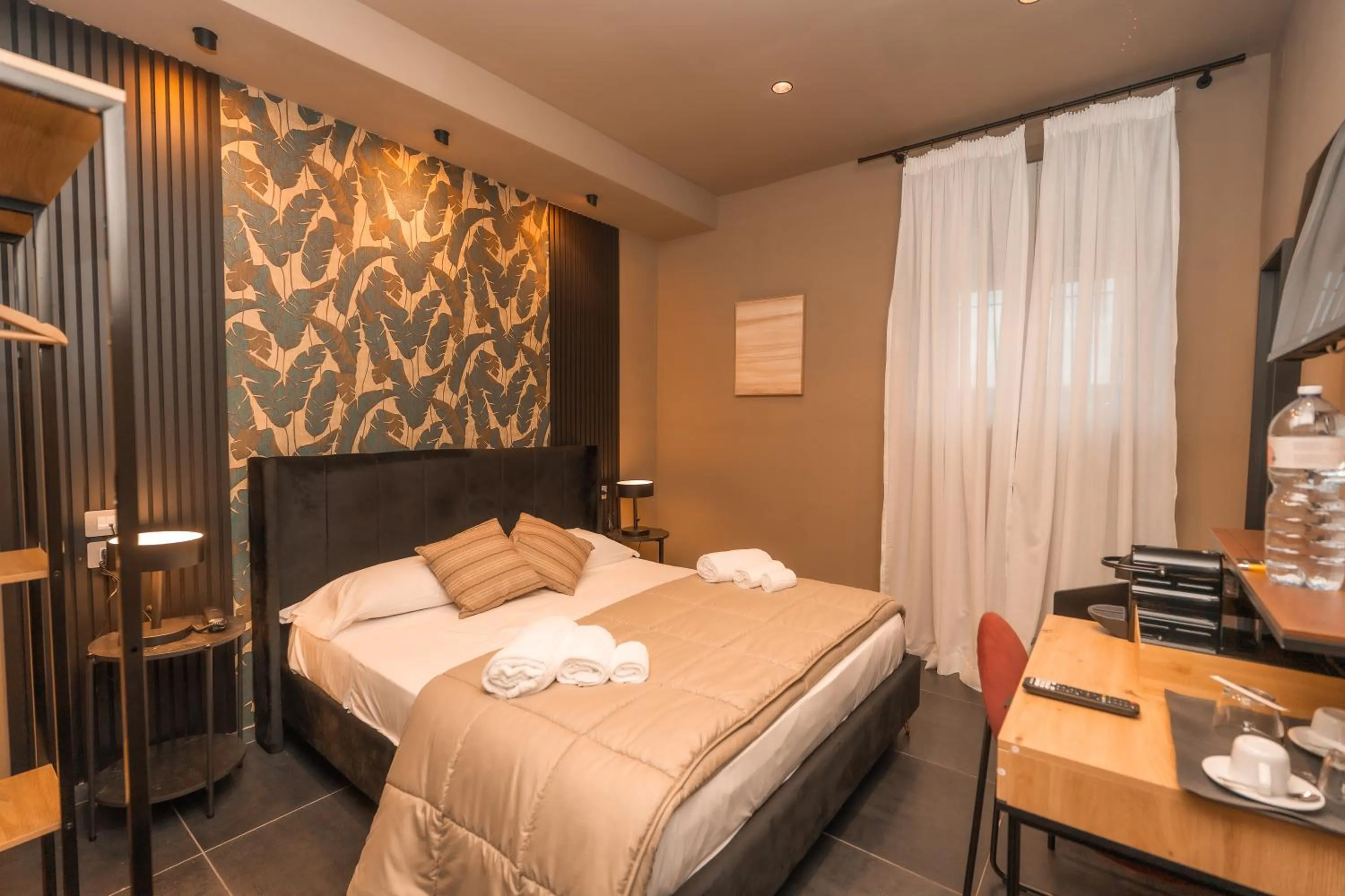 Bed in Noah Gate Hotel & Suites