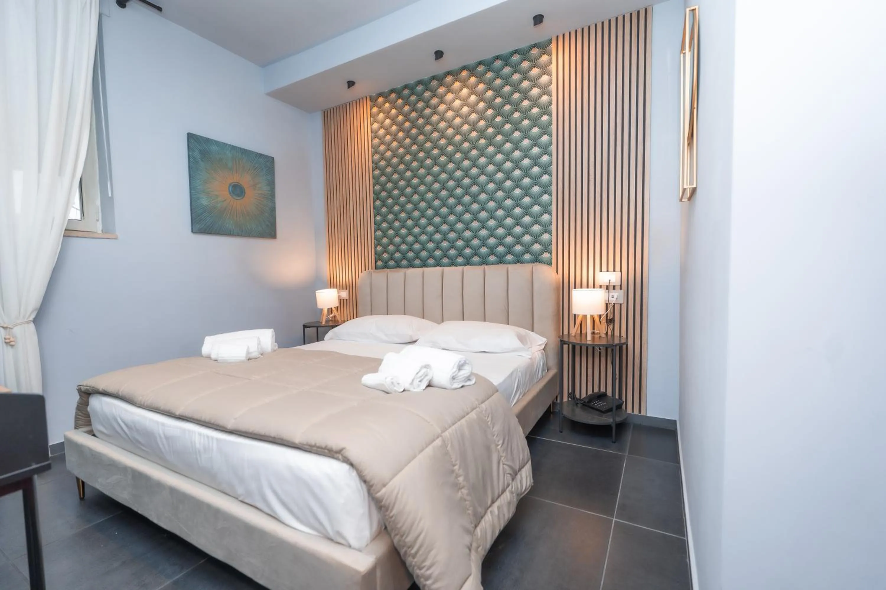 Bed in Noah Gate Hotel & Suites