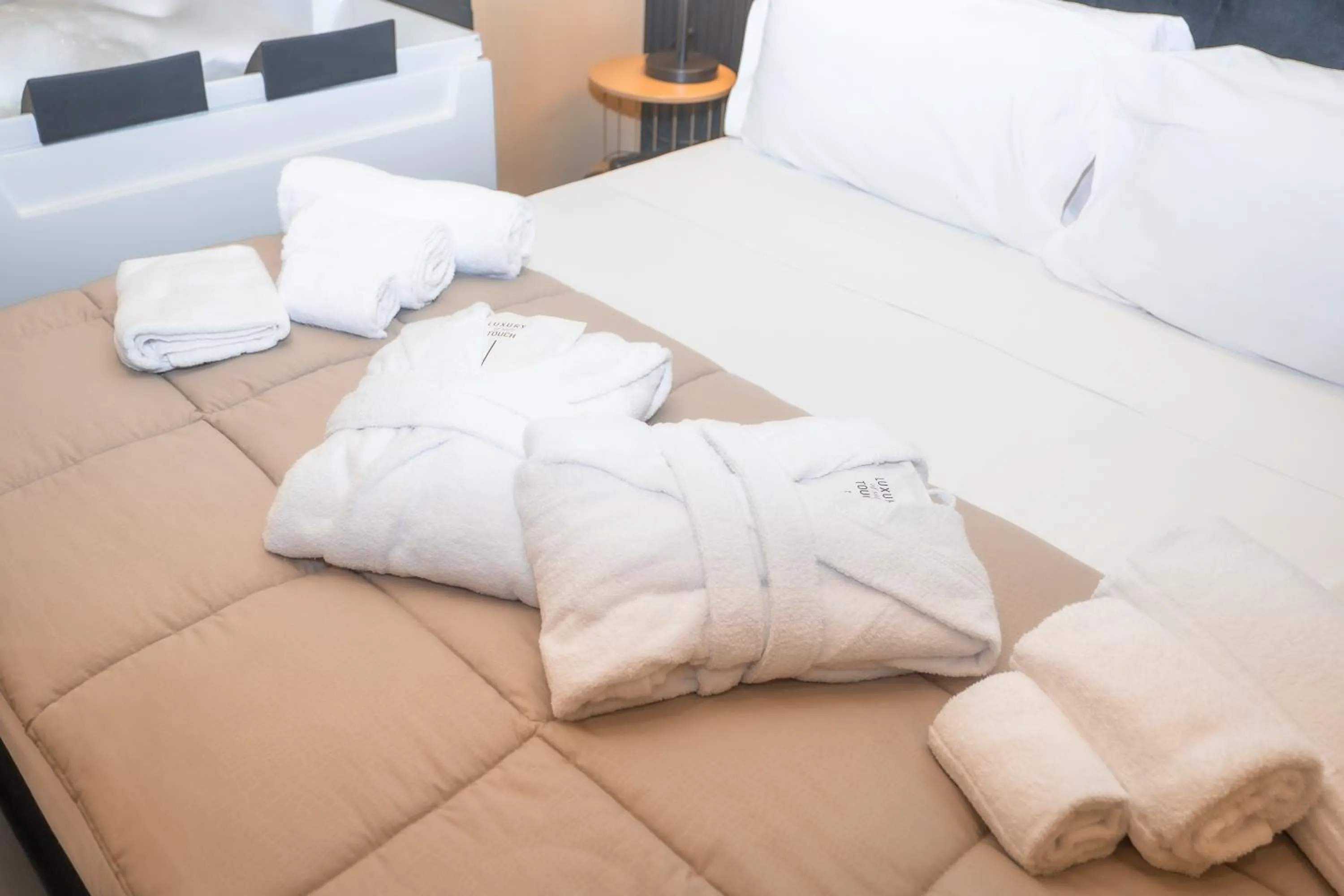 Bed in Noah Gate Hotel & Suites