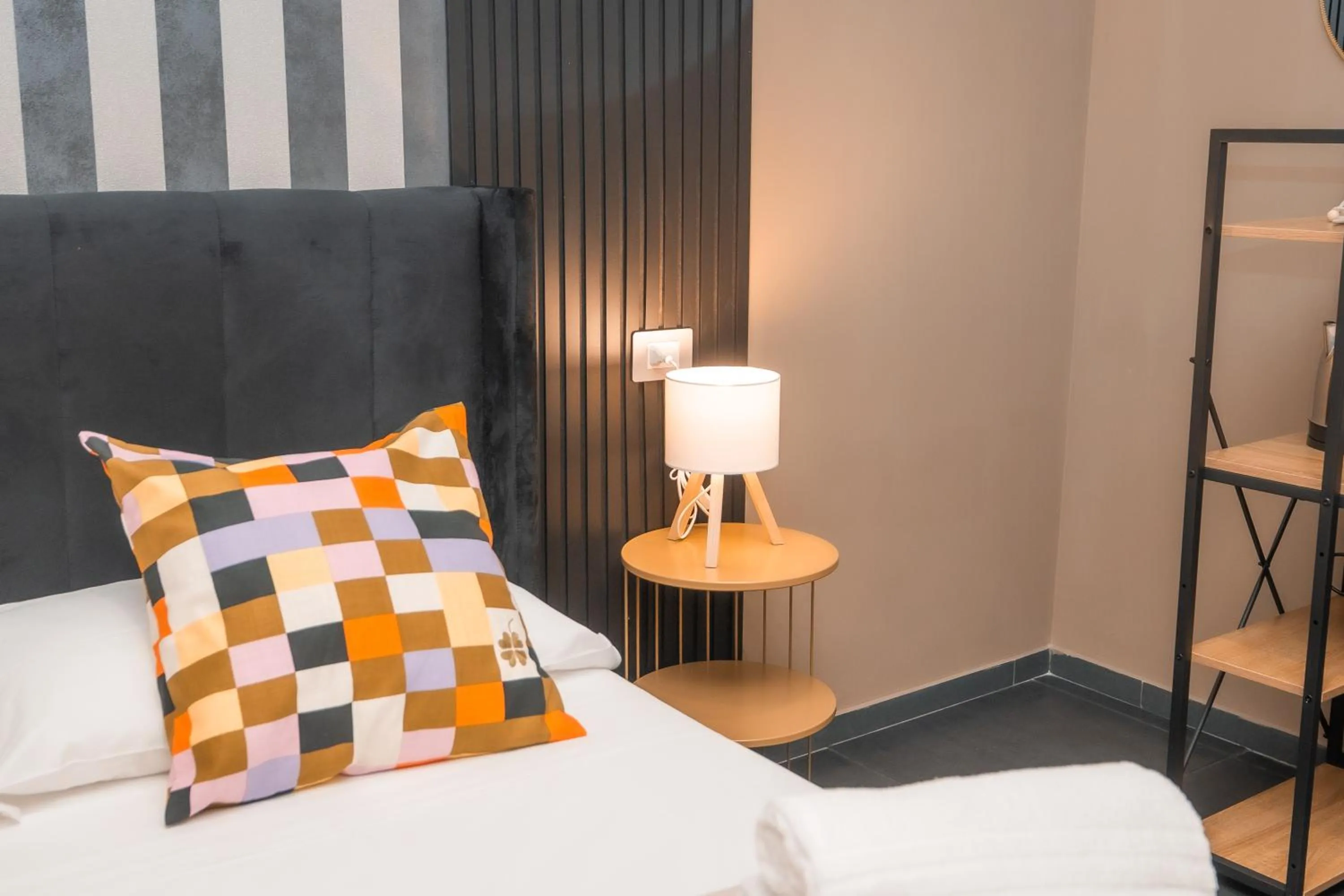 Bed in Noah Gate Hotel & Suites