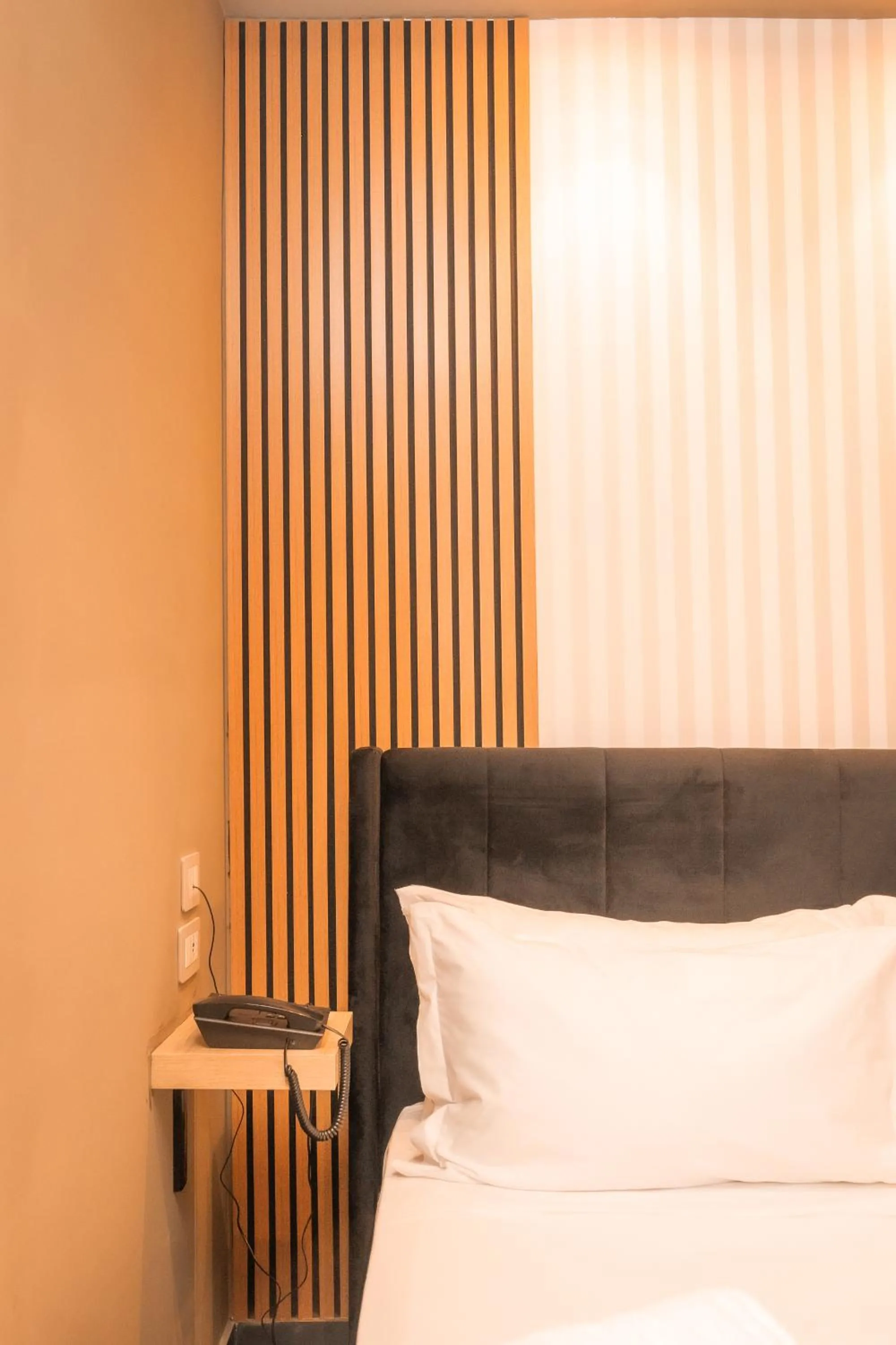Bed in Noah Gate Hotel & Suites