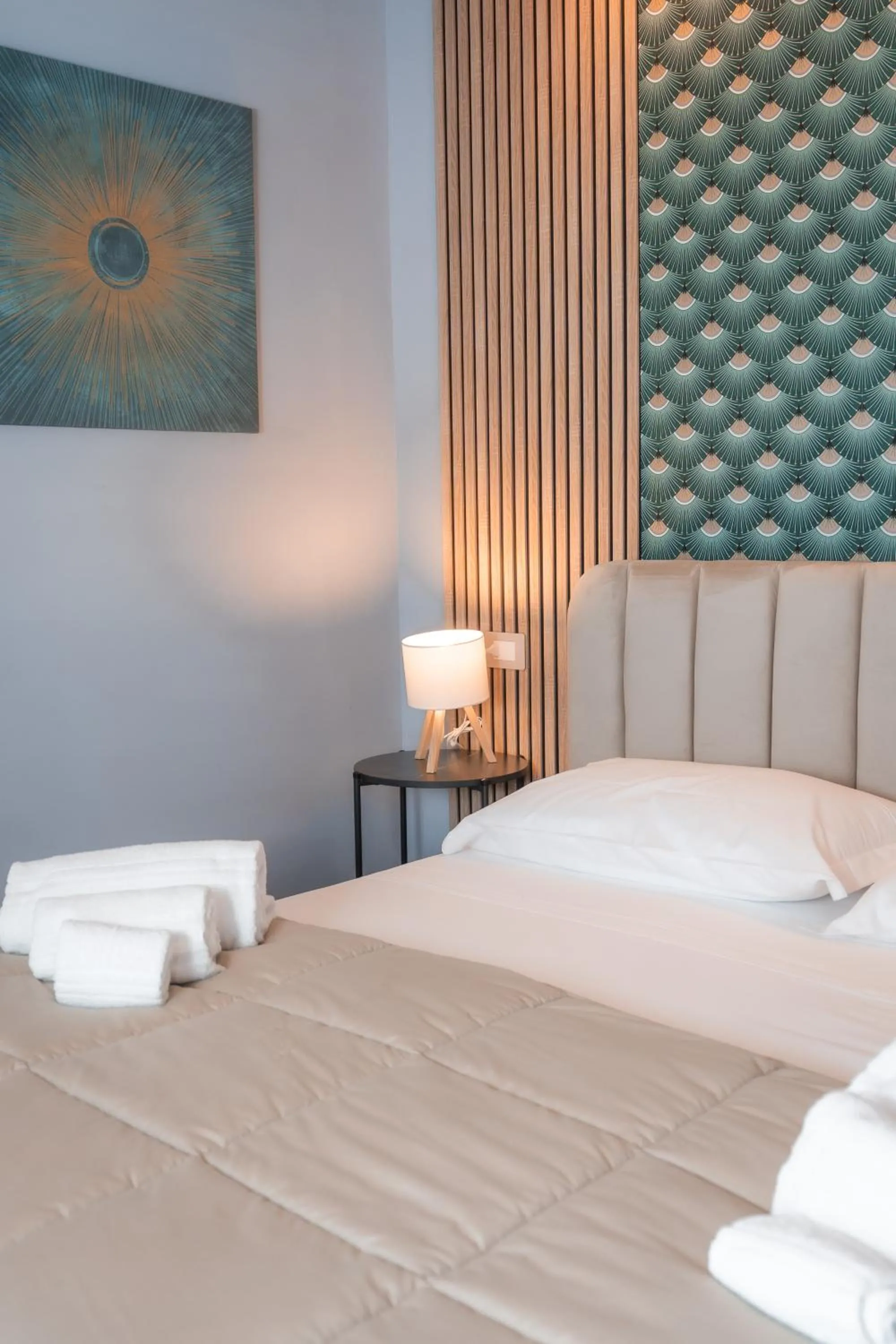 Bed in Noah Gate Hotel & Suites