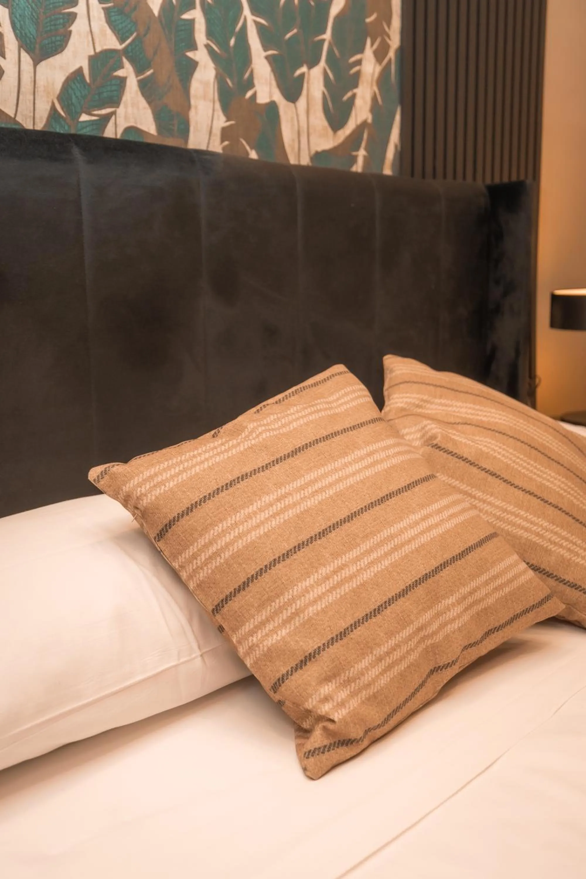 Bed in Noah Gate Hotel & Suites