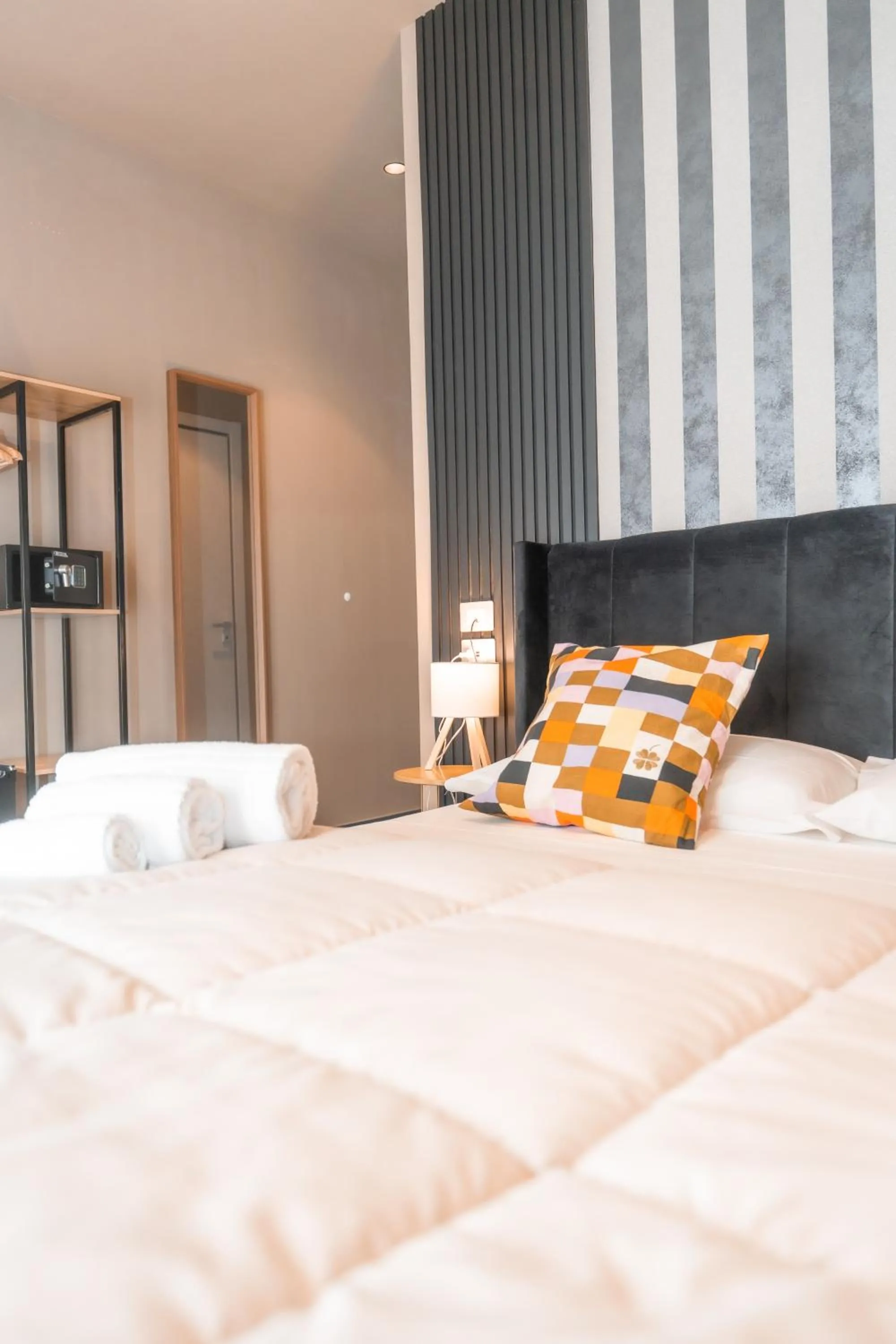 Bed in Noah Gate Hotel & Suites