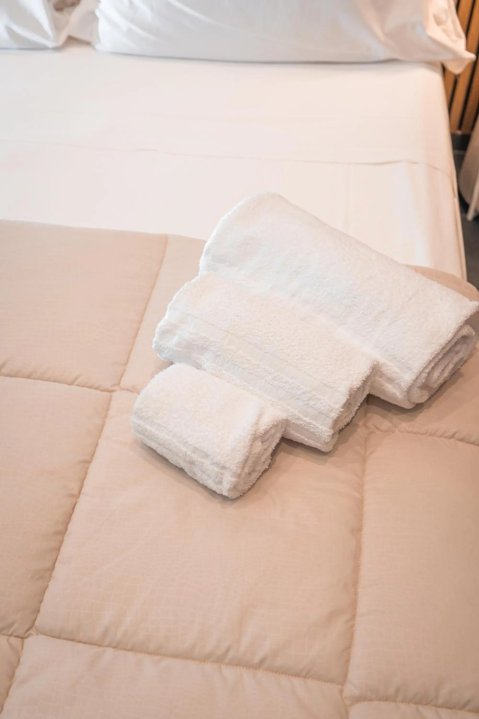 Bed in Noah Gate Hotel & Suites