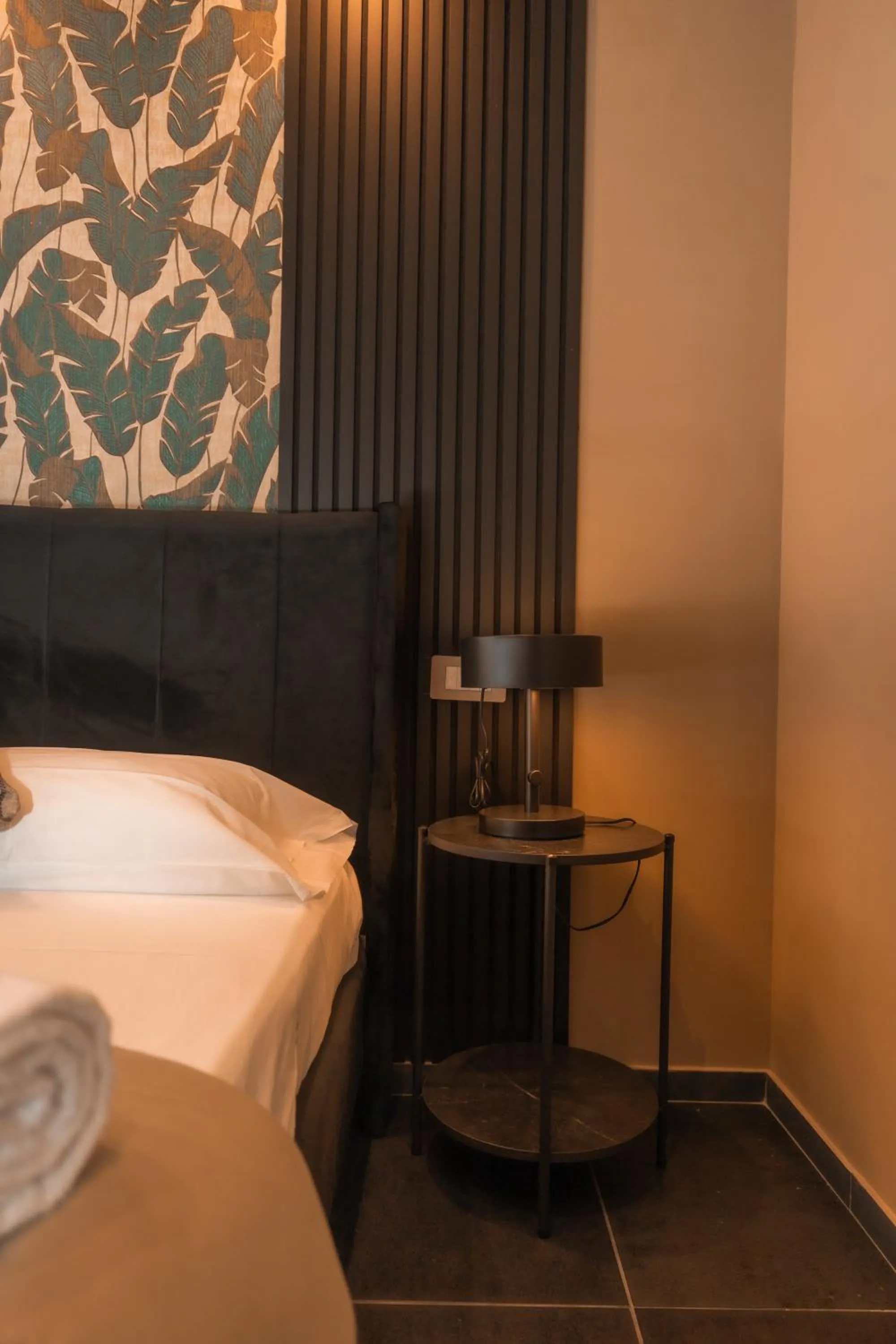 Bed in Noah Gate Hotel & Suites
