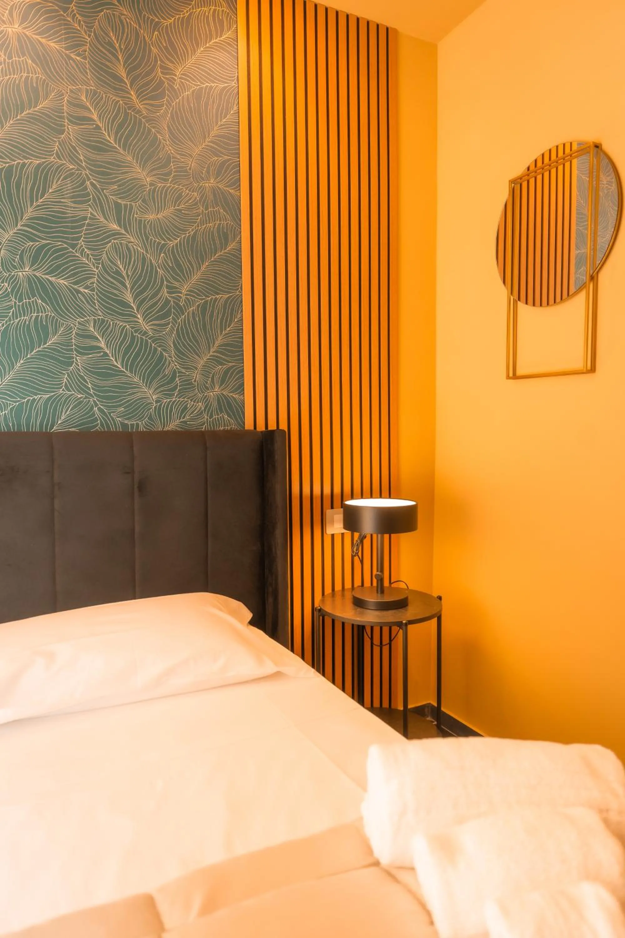 Bed in Noah Gate Hotel & Suites