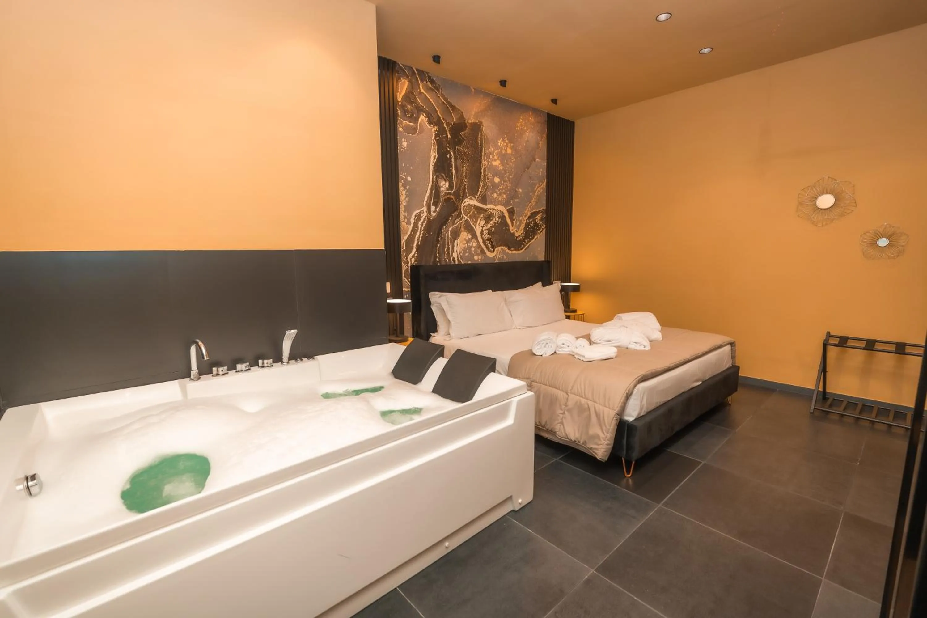 Bed in Noah Gate Hotel & Suites