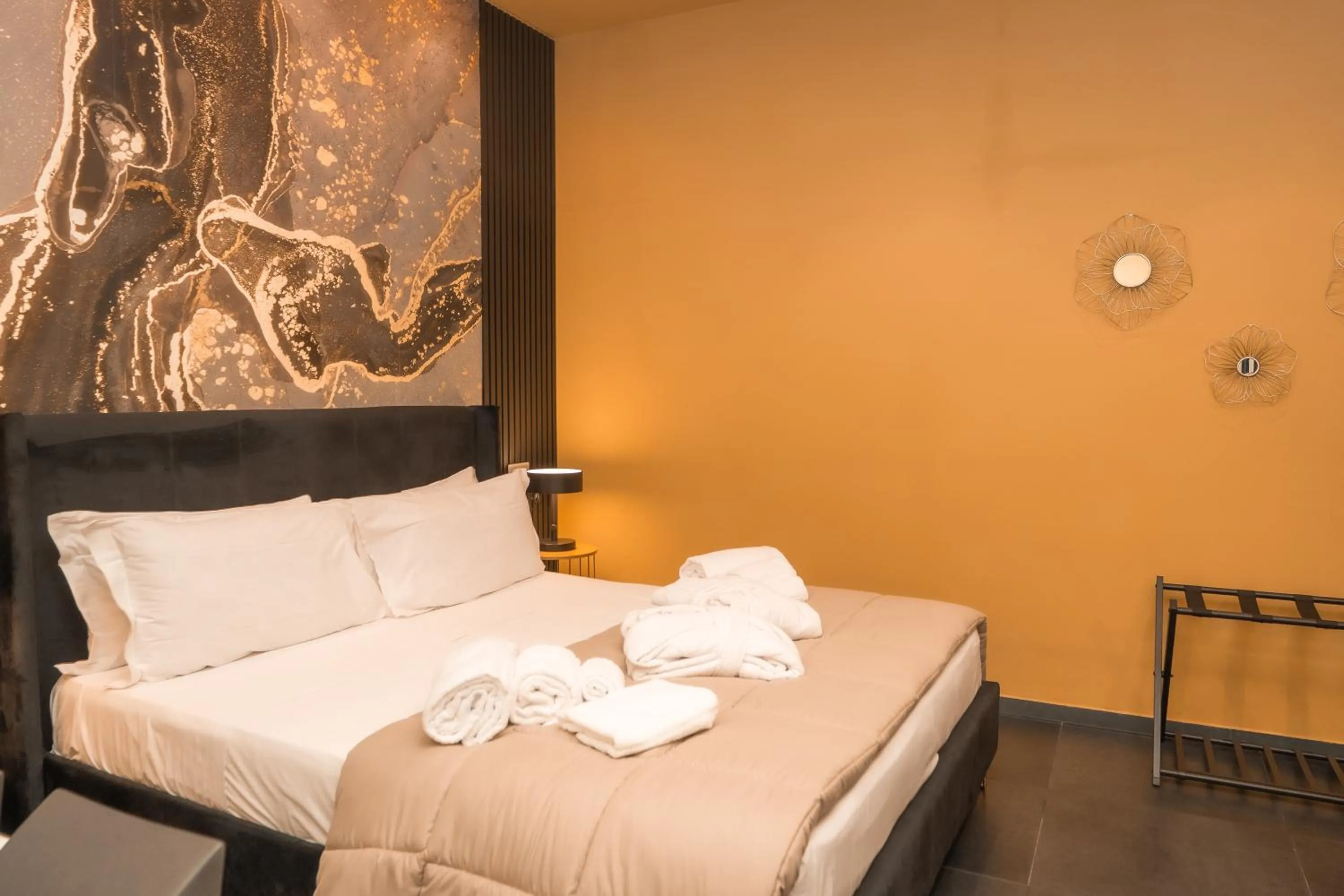 Bed in Noah Gate Hotel & Suites