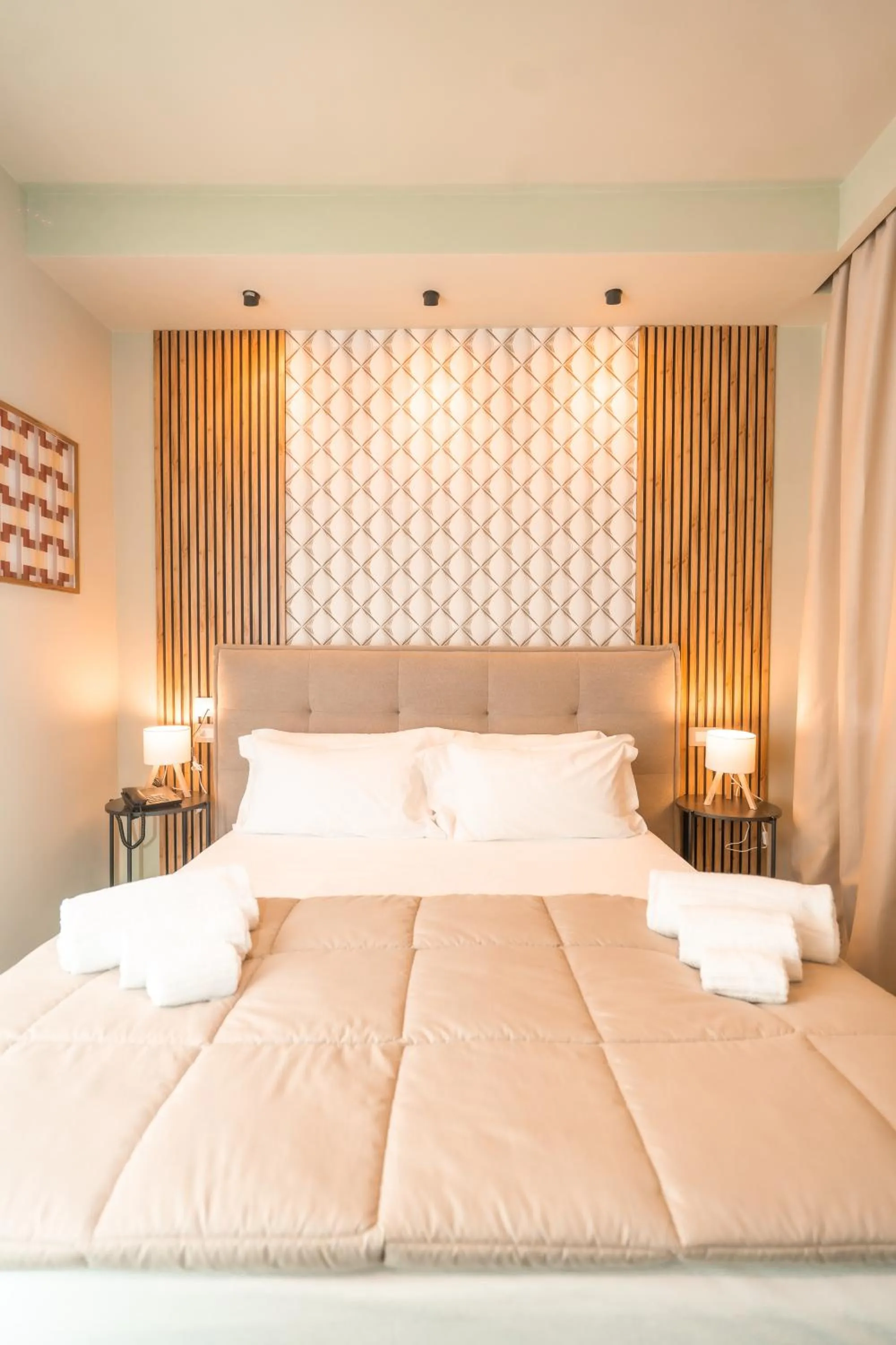 Bed in Noah Gate Hotel & Suites