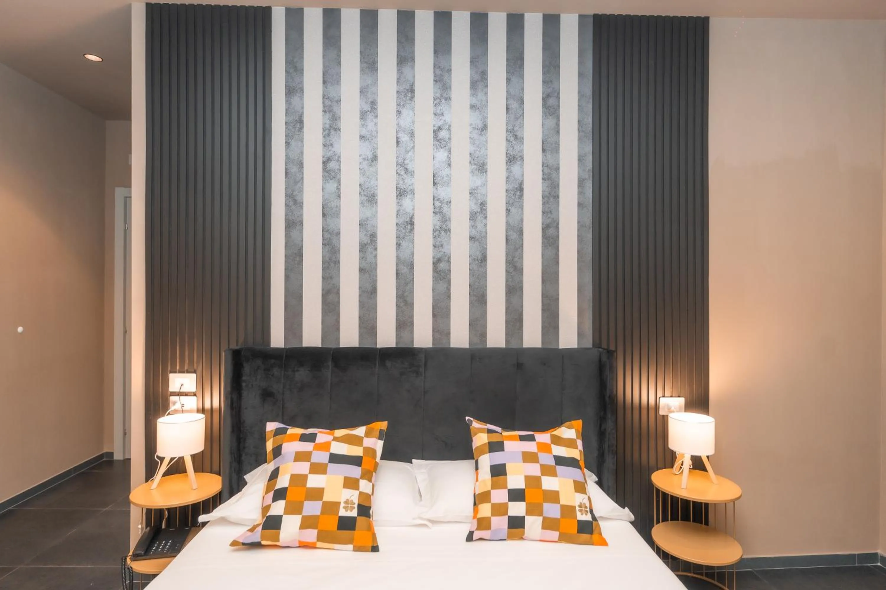 Bed in Noah Gate Hotel & Suites