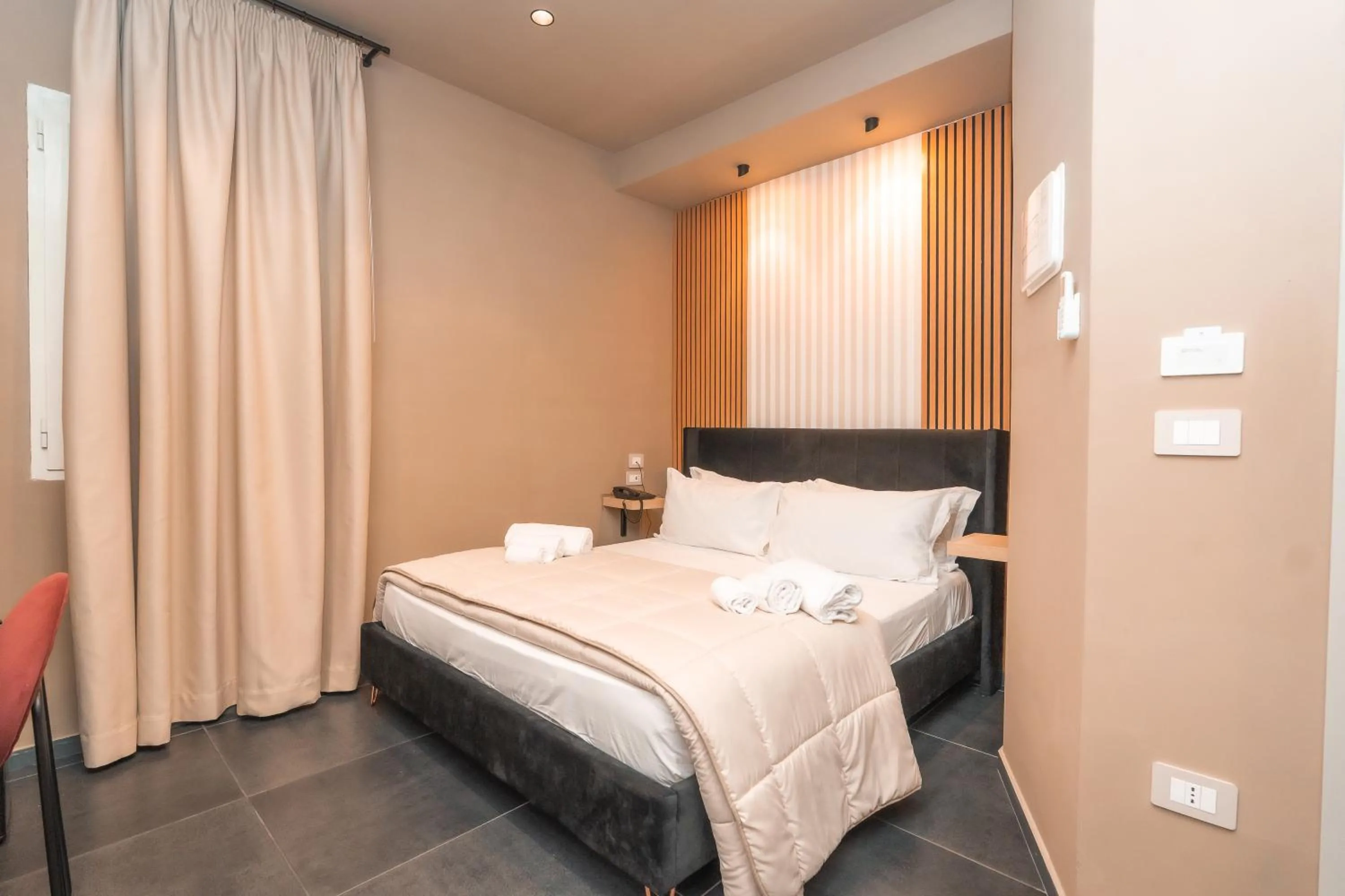 Bed in Noah Gate Hotel & Suites