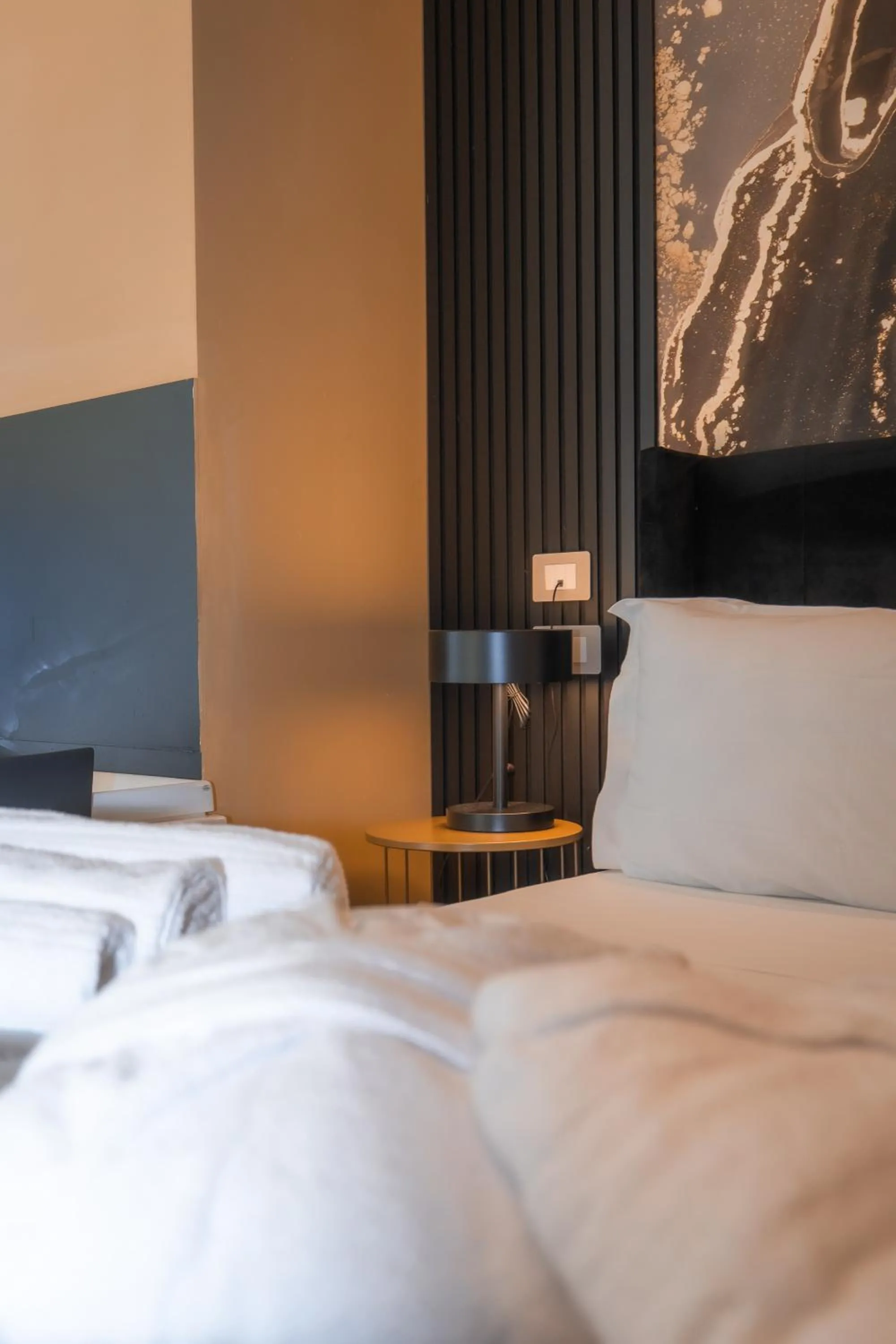 Bed in Noah Gate Hotel & Suites