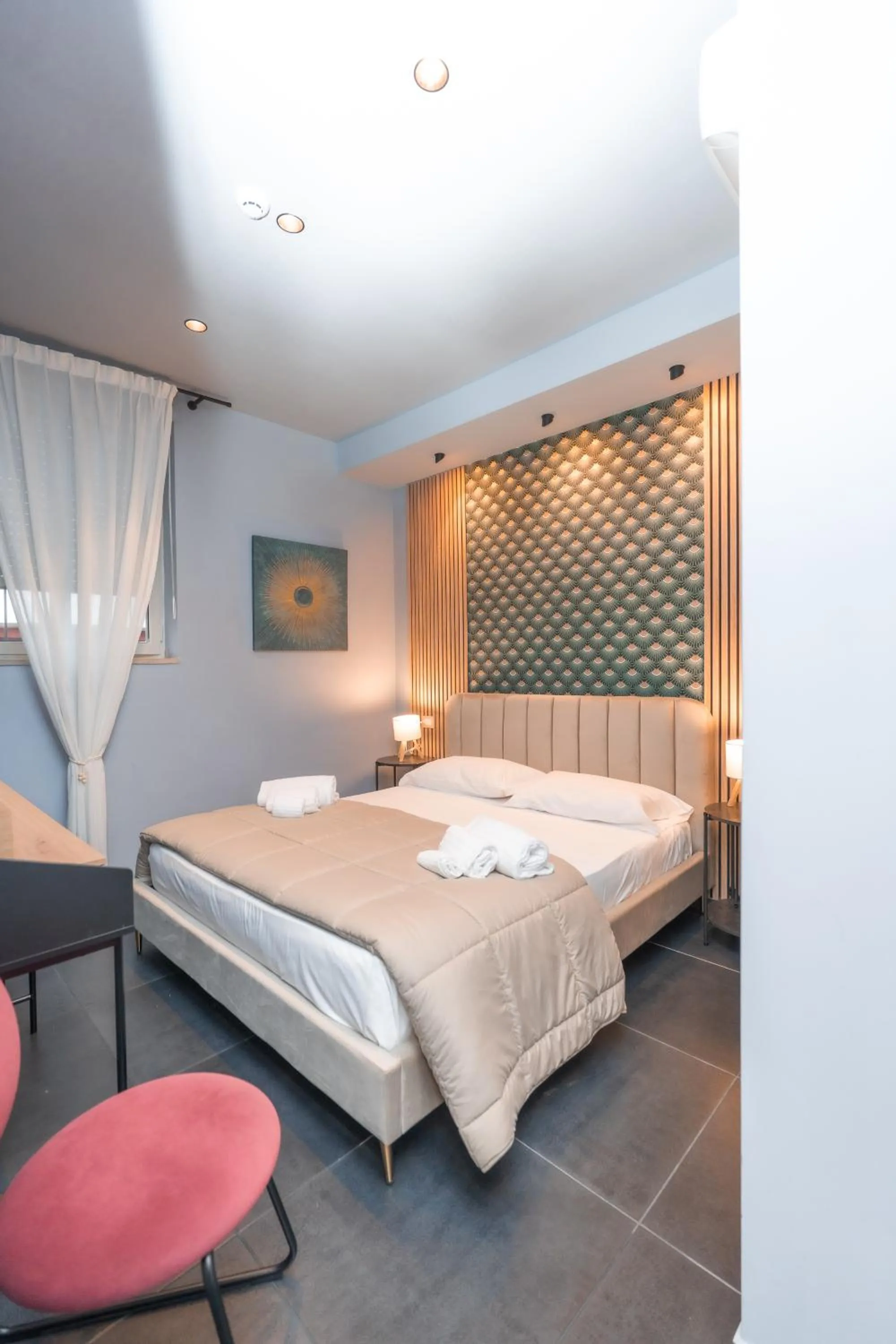 Bed in Noah Gate Hotel & Suites