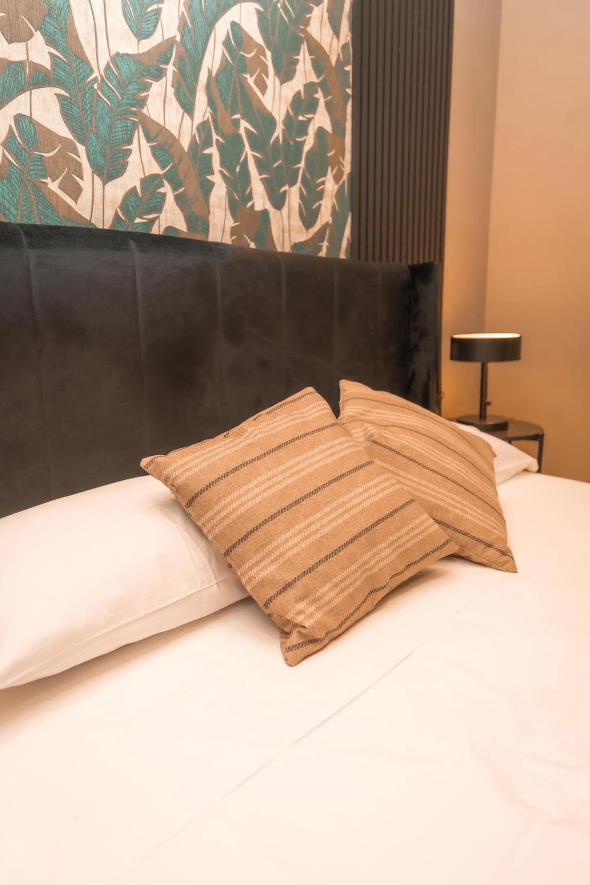 Bed in Noah Gate Hotel & Suites