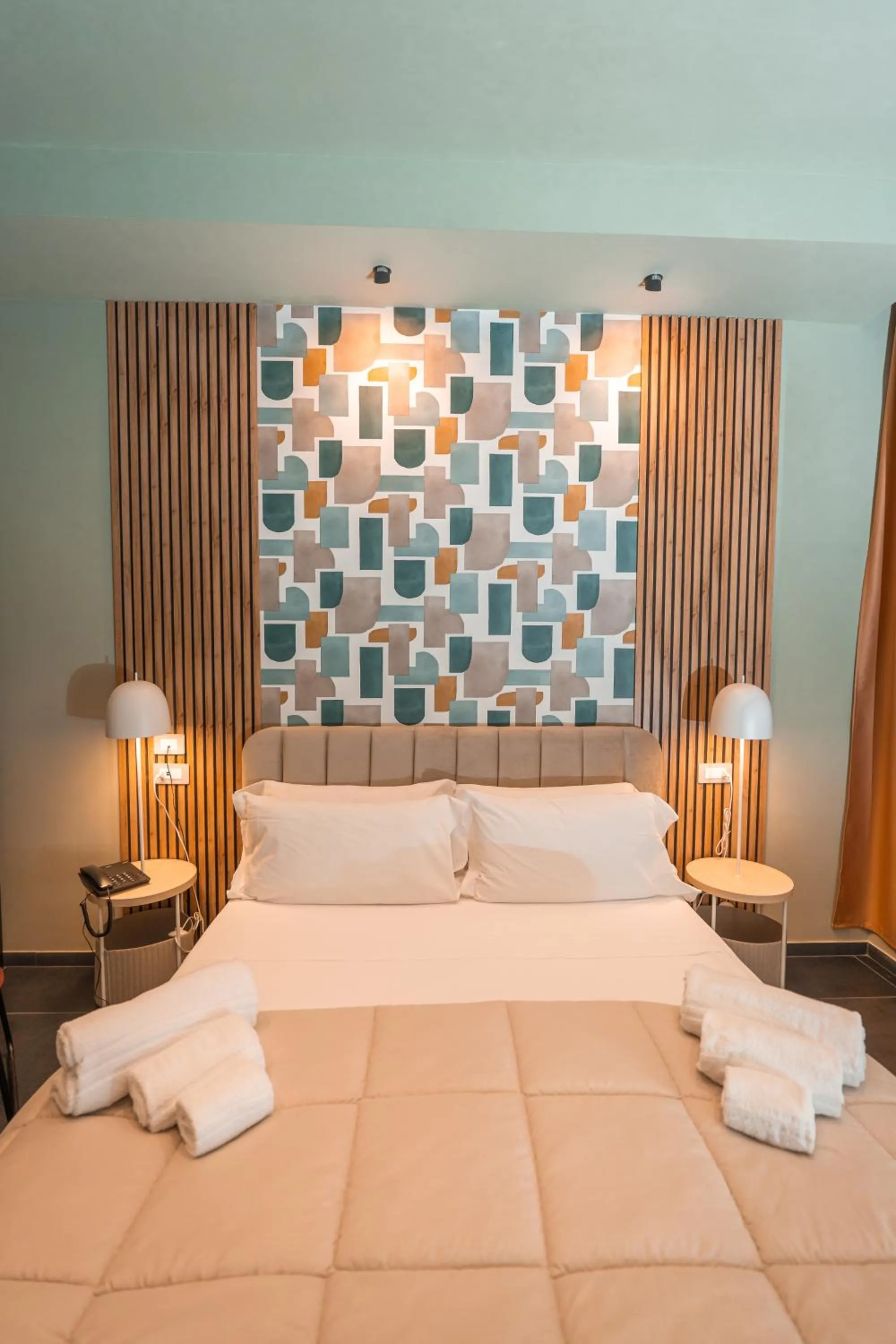 Bed in Noah Gate Hotel & Suites