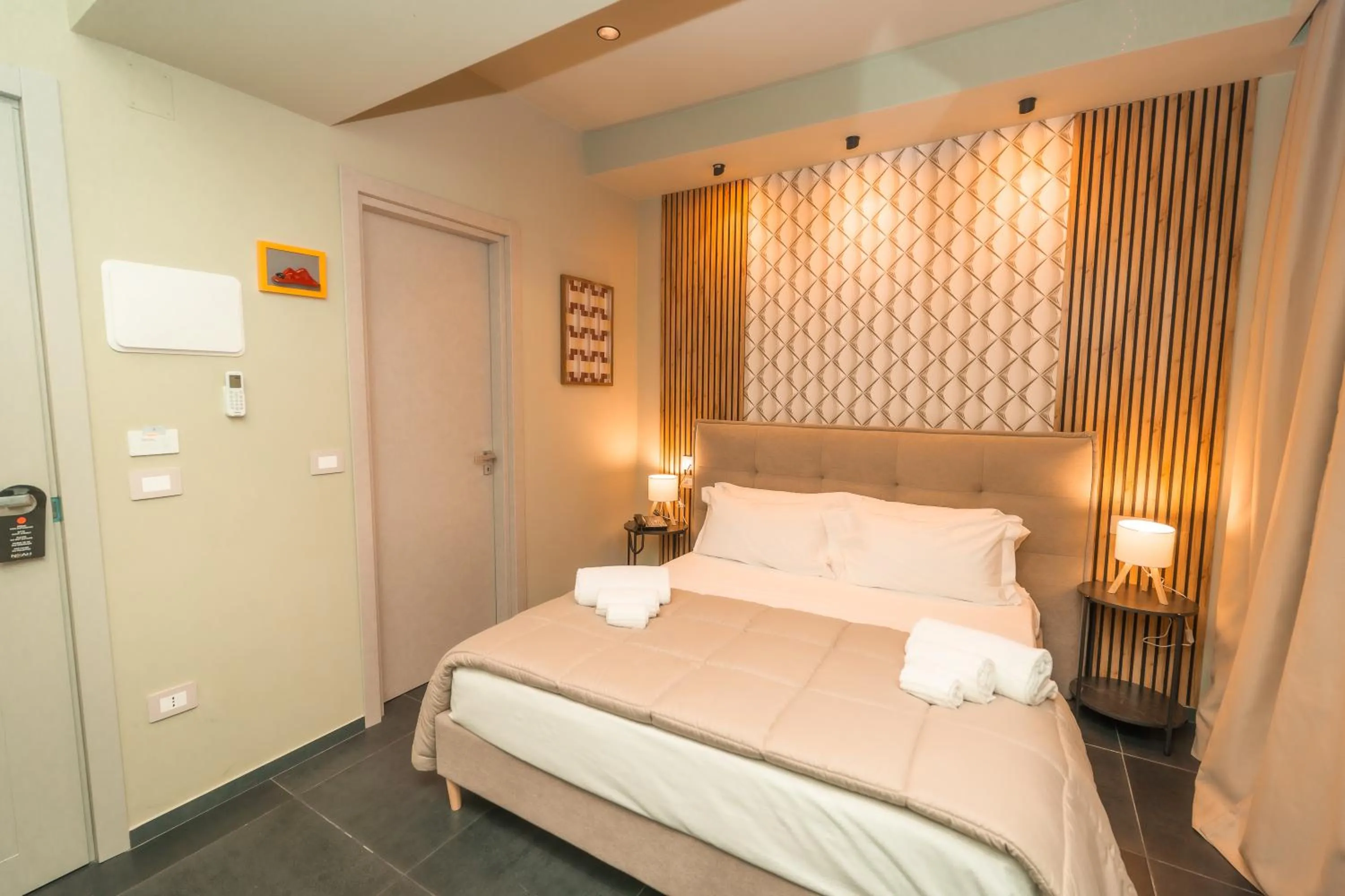 Bed in Noah Gate Hotel & Suites