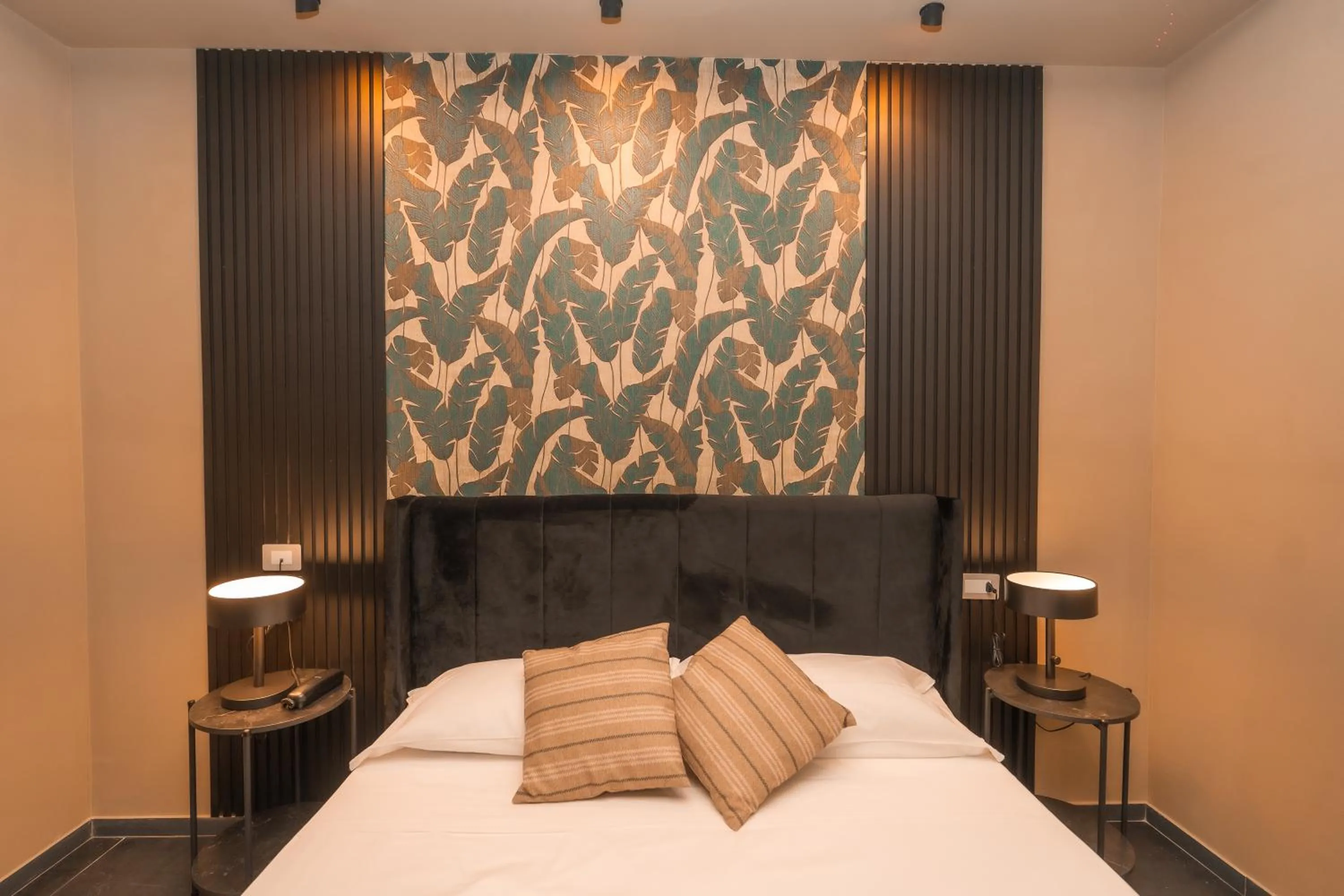 Bed in Noah Gate Hotel & Suites