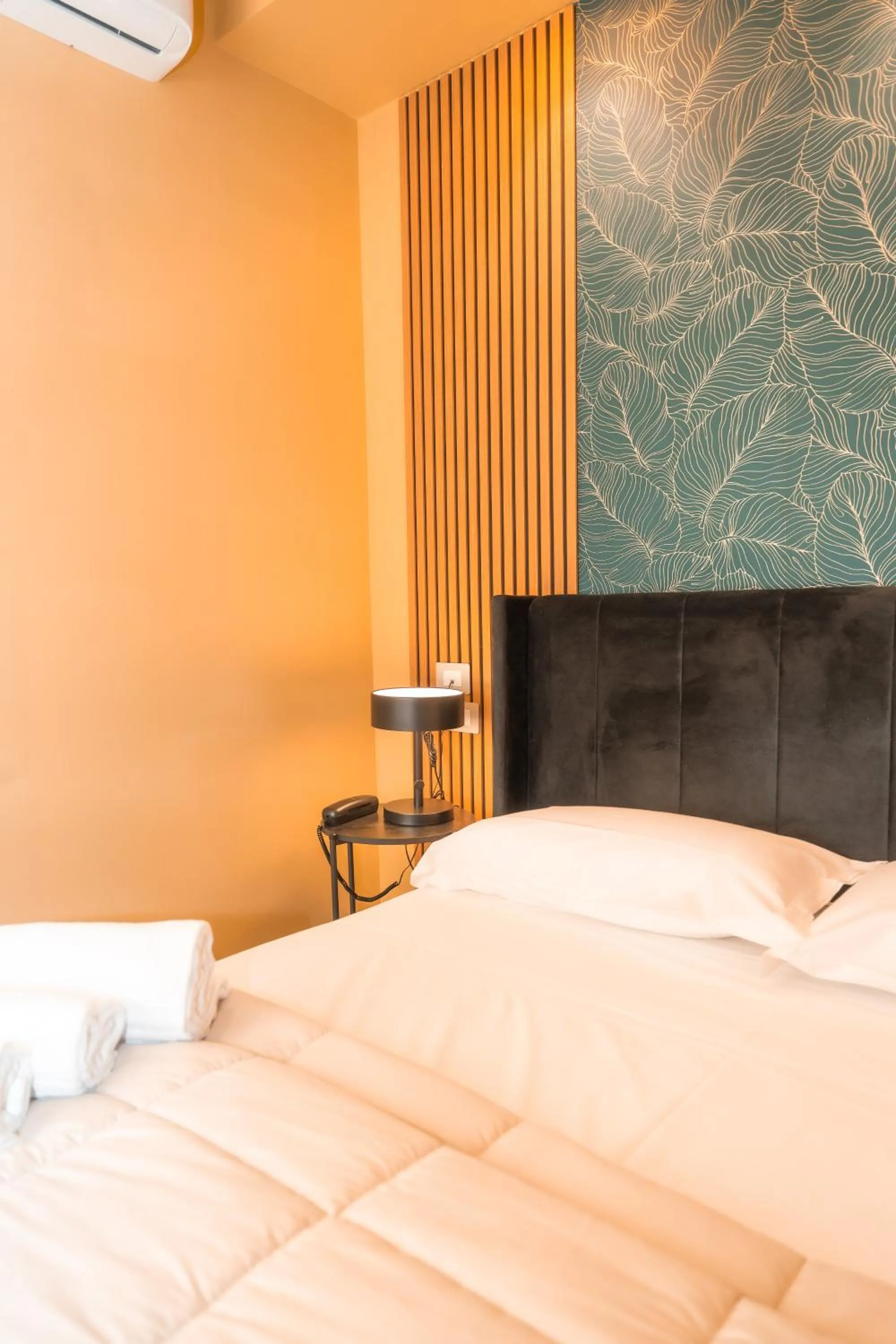 Bed in Noah Gate Hotel & Suites