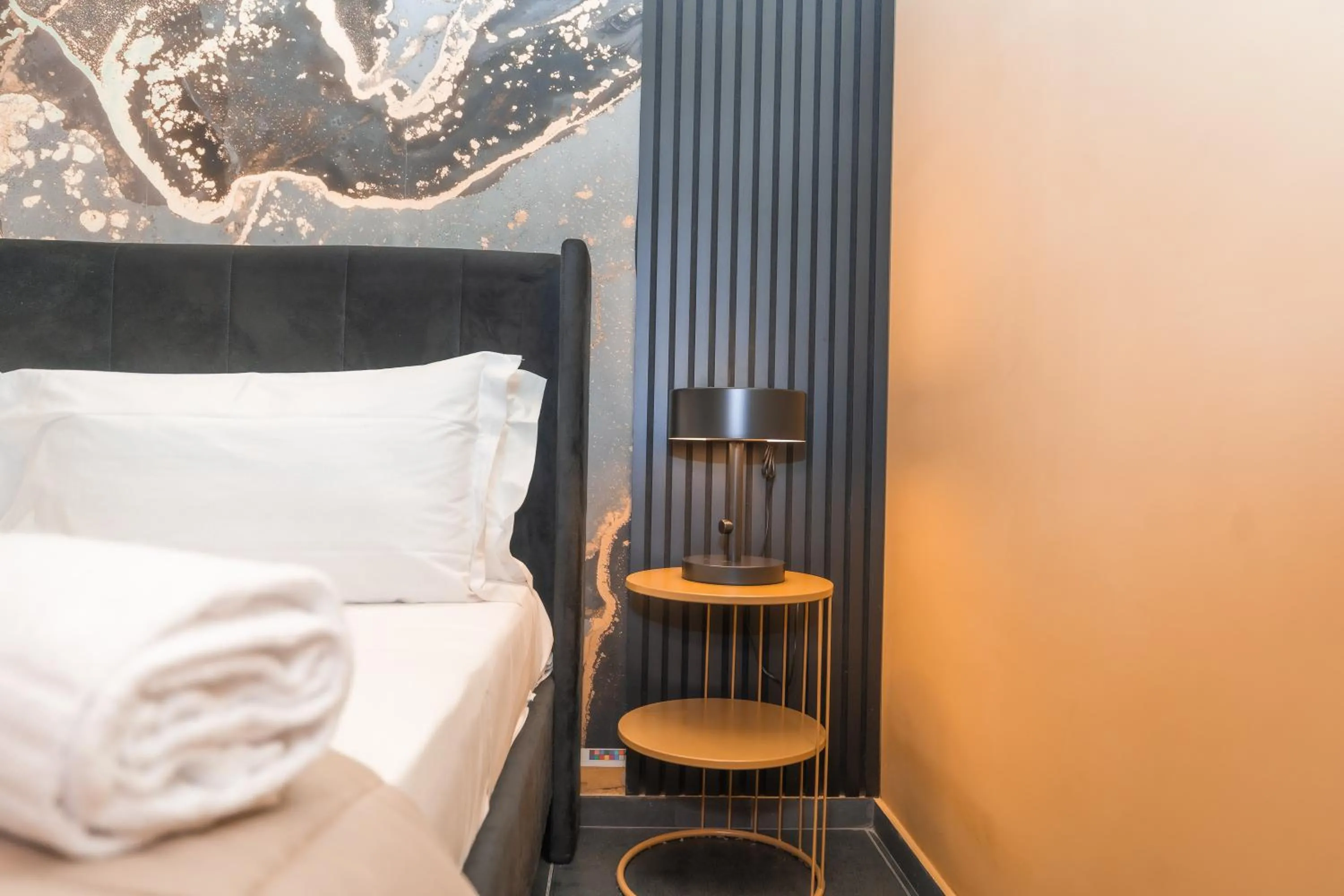 Bed in Noah Gate Hotel & Suites
