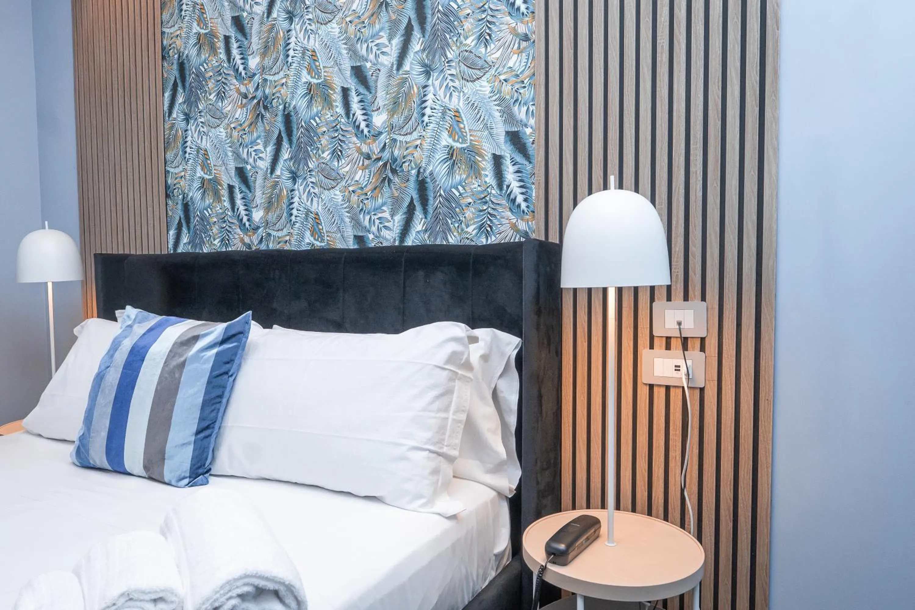 Bed in Noah Gate Hotel & Suites