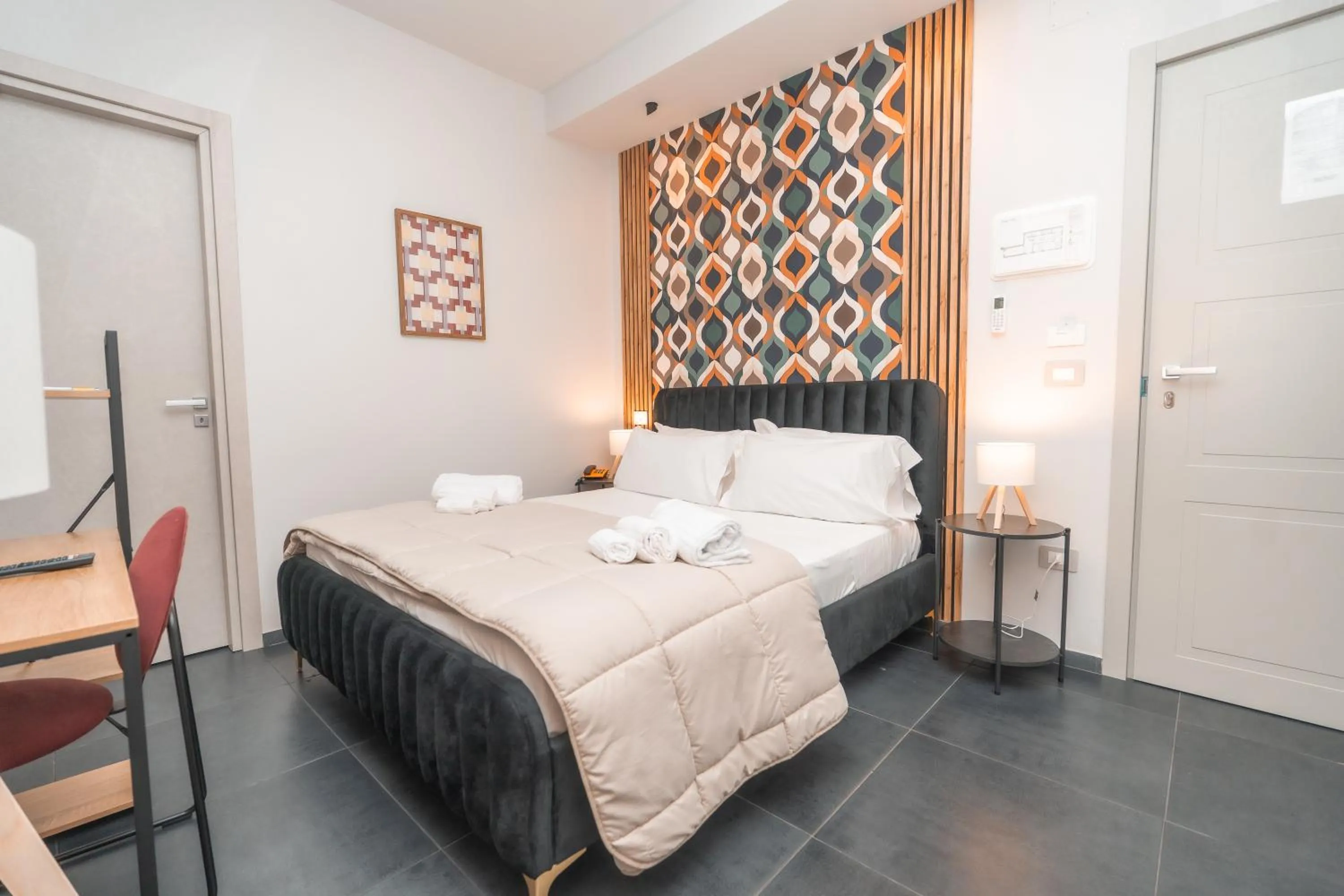 Bed in Noah Gate Hotel & Suites