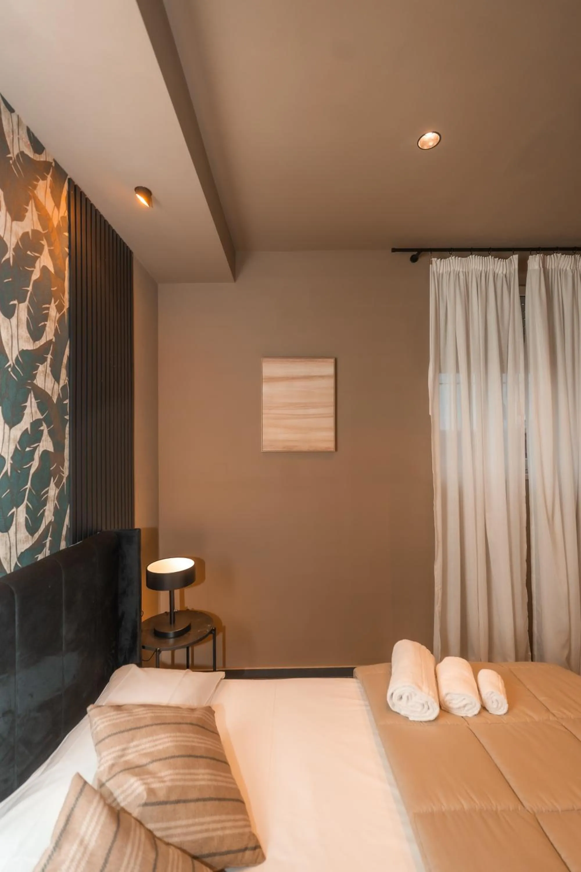 Bed in Noah Gate Hotel & Suites