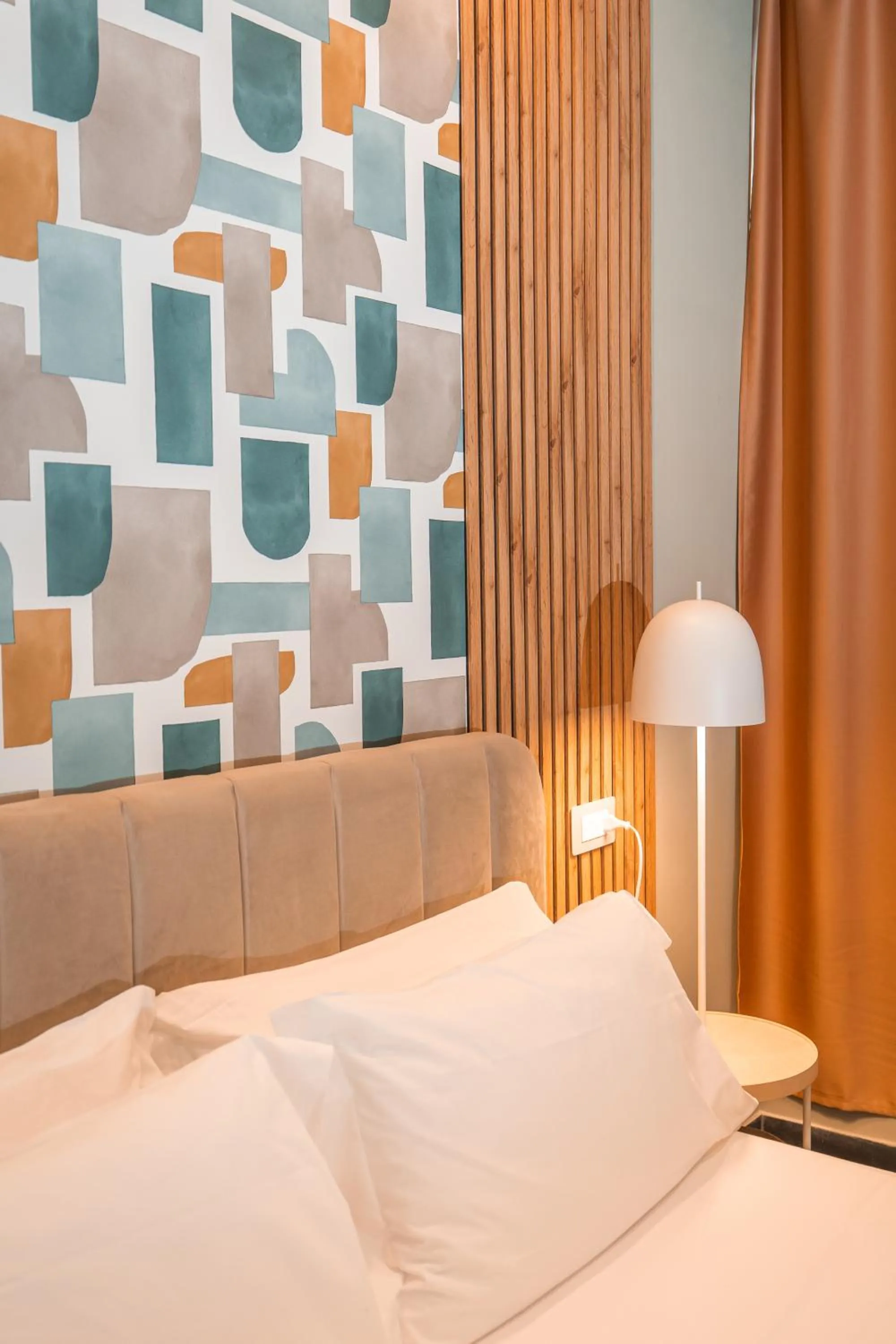 Bed in Noah Gate Hotel & Suites