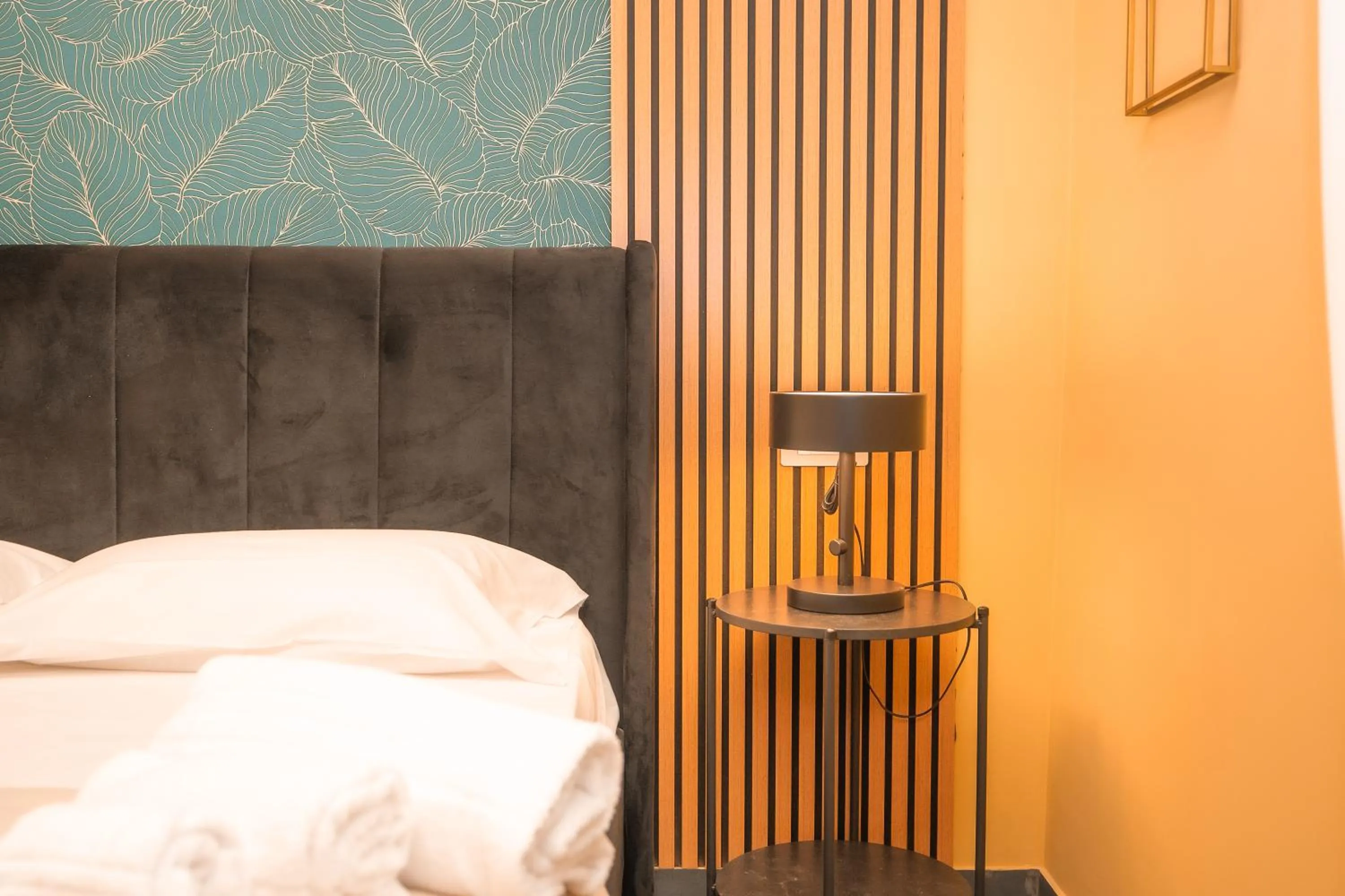 Bed in Noah Gate Hotel & Suites