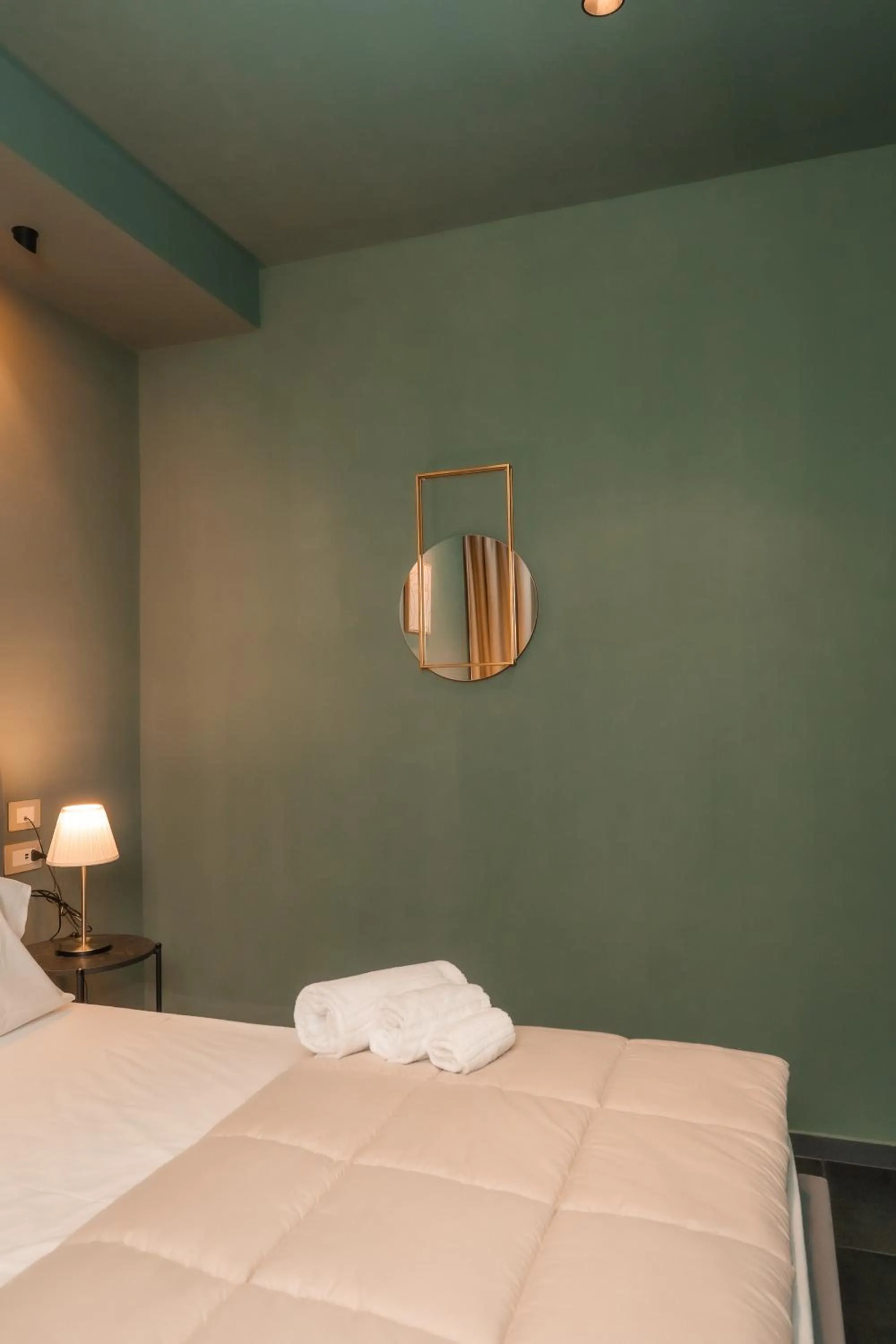 Bed in Noah Gate Hotel & Suites