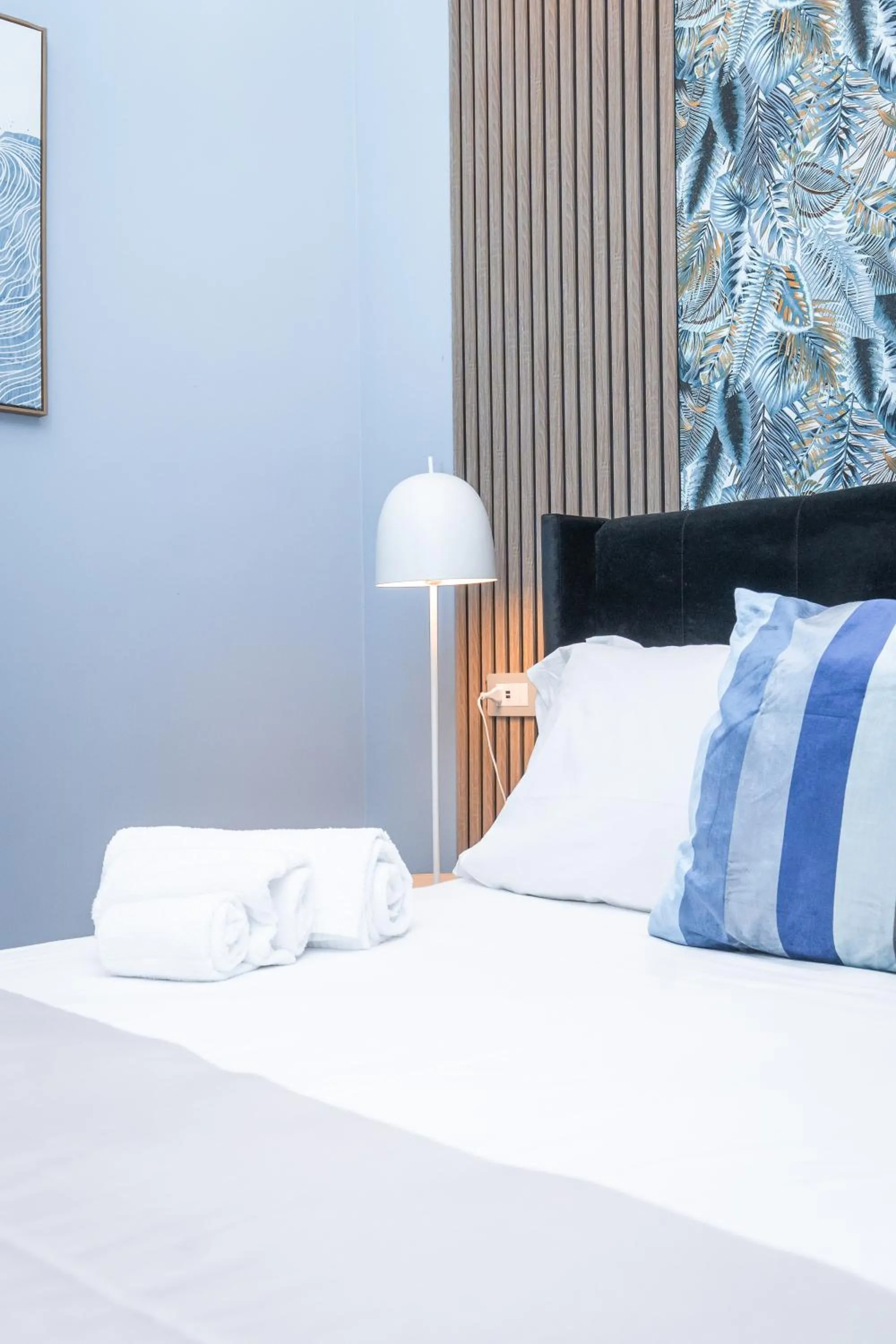 Bed in Noah Gate Hotel & Suites