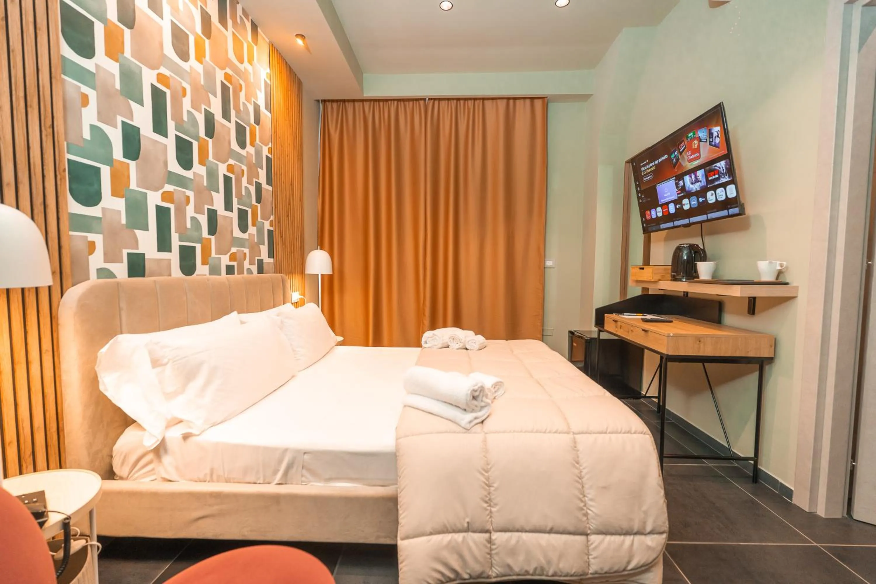 Bed in Noah Gate Hotel & Suites