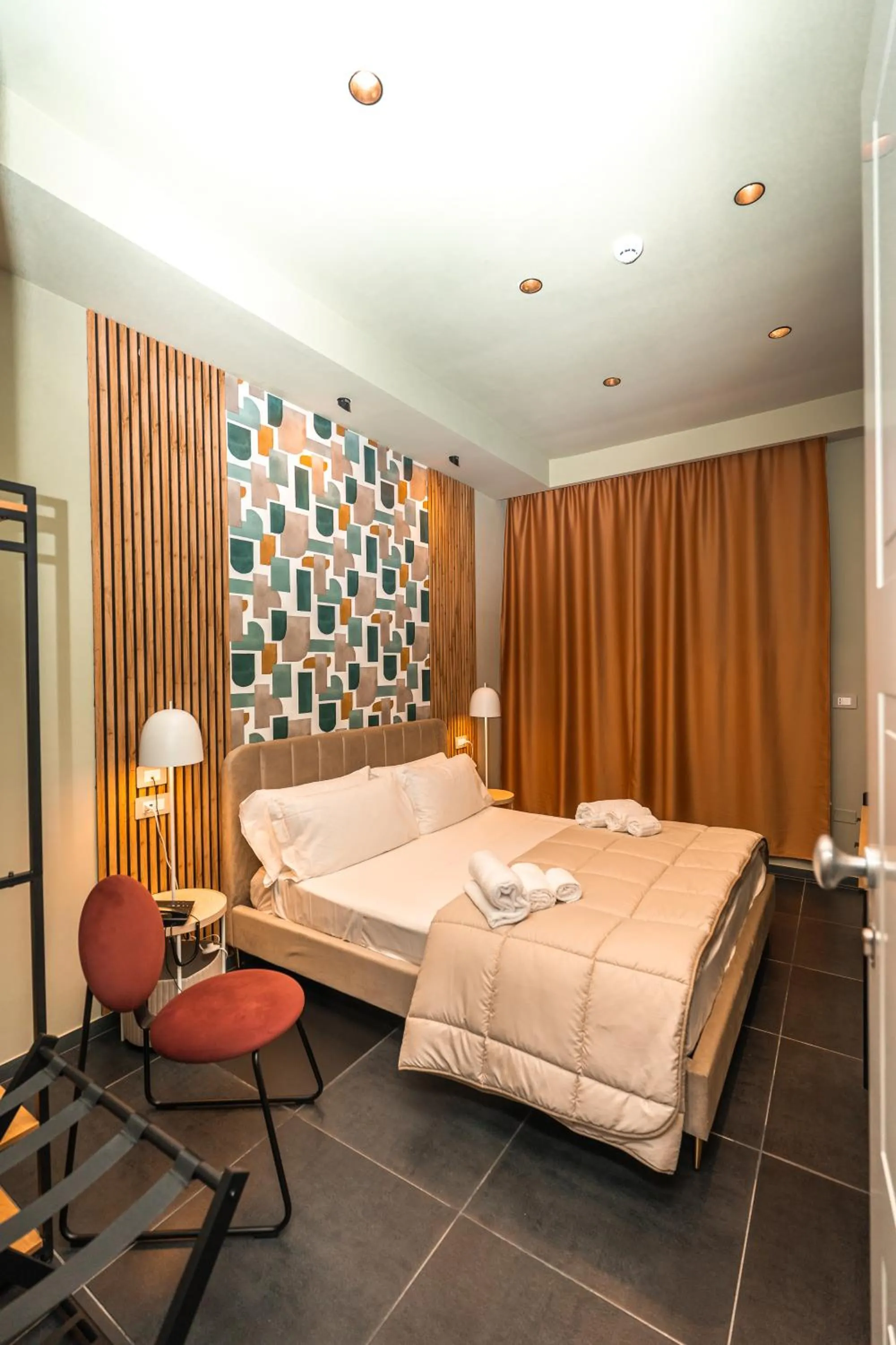 Bed in Noah Gate Hotel & Suites