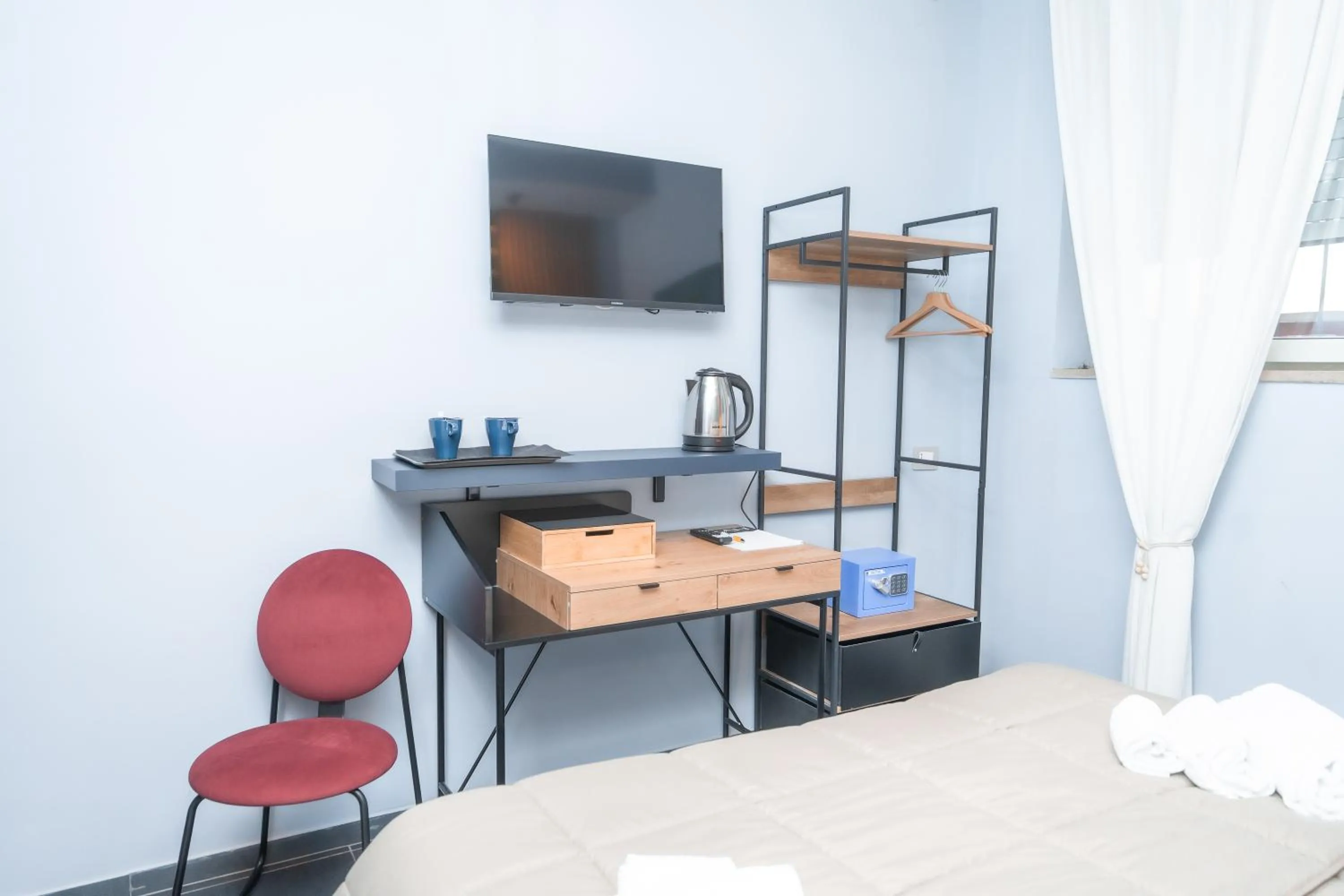 Bed in Noah Gate Hotel & Suites