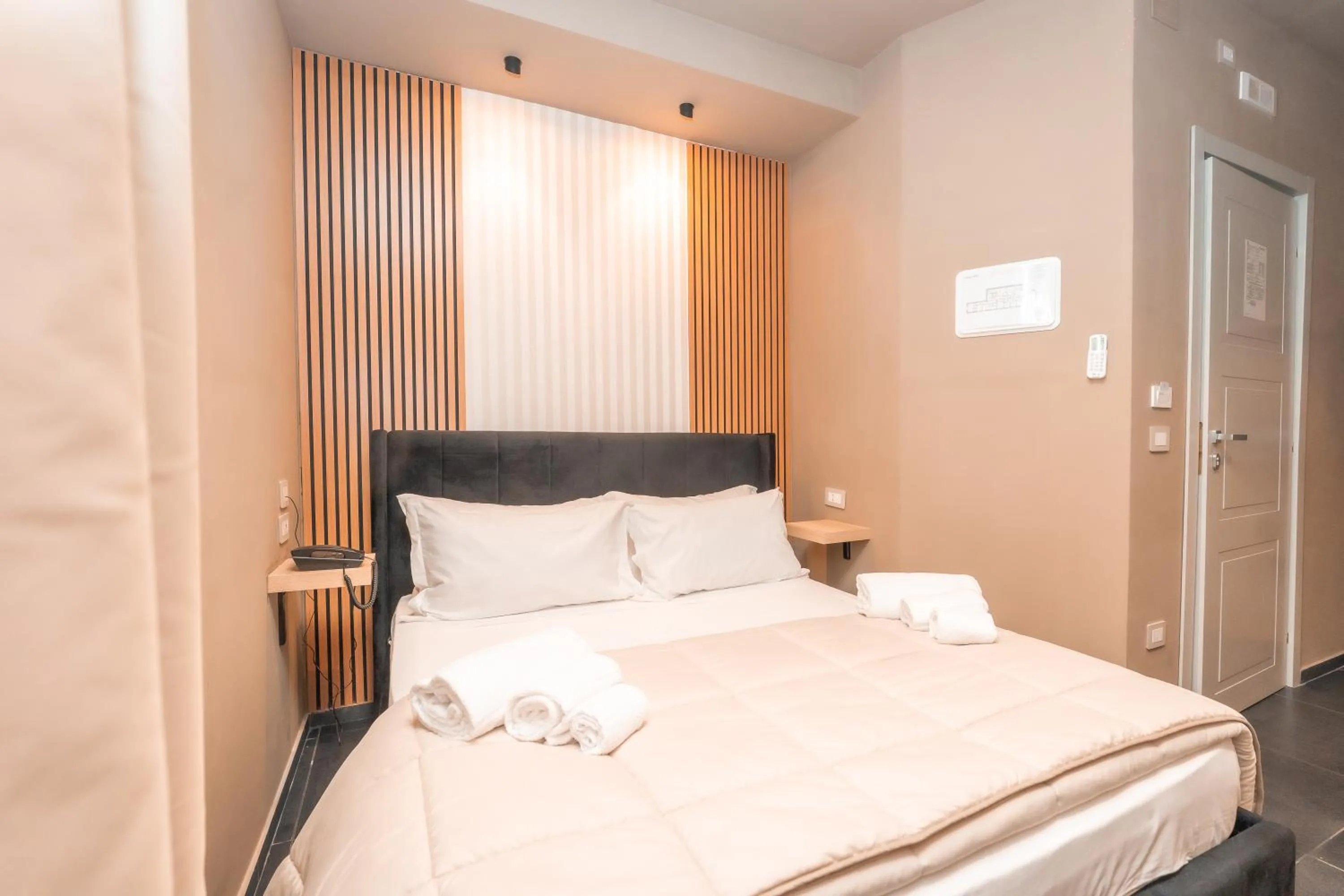 Bed in Noah Gate Hotel & Suites