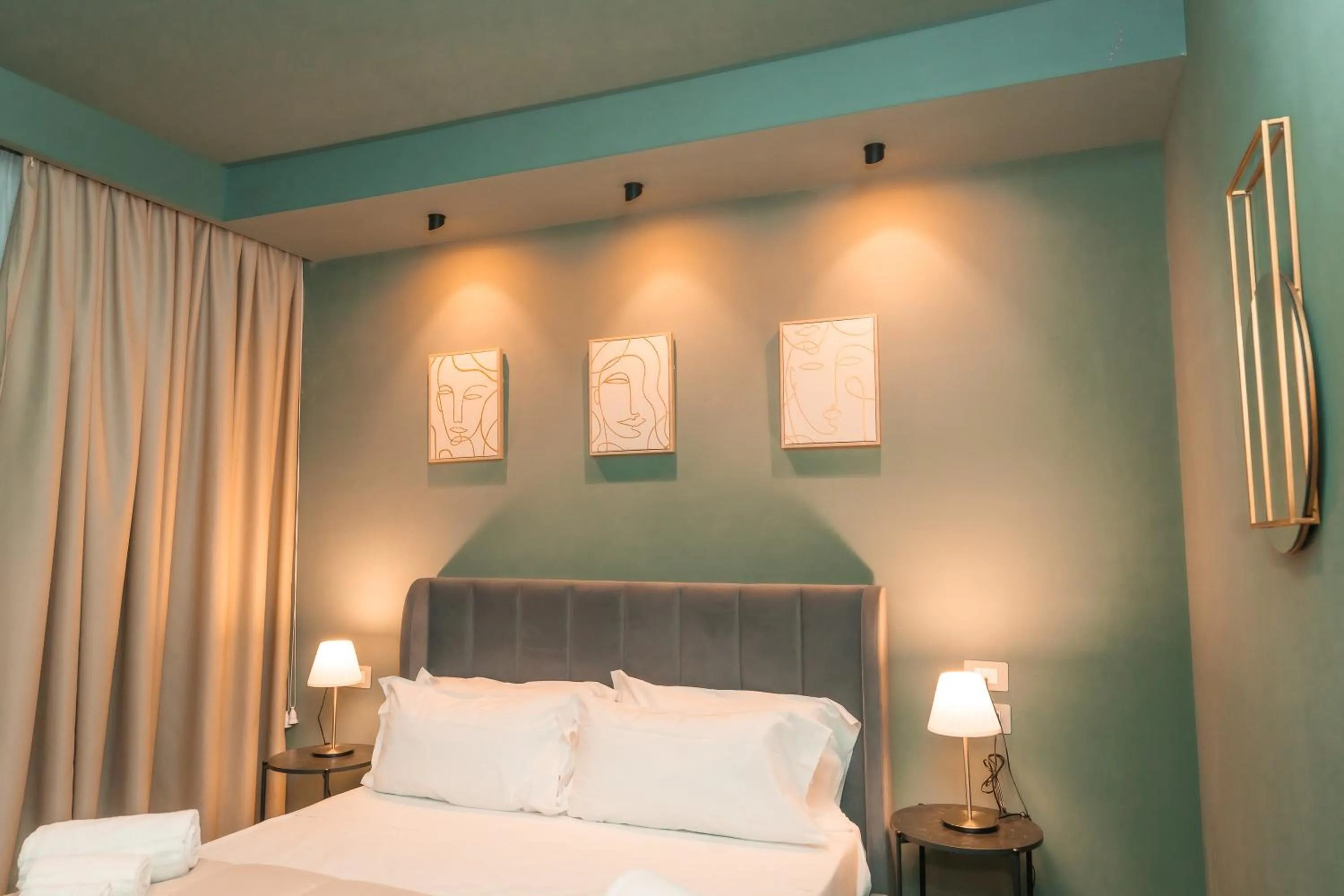 Bed in Noah Gate Hotel & Suites
