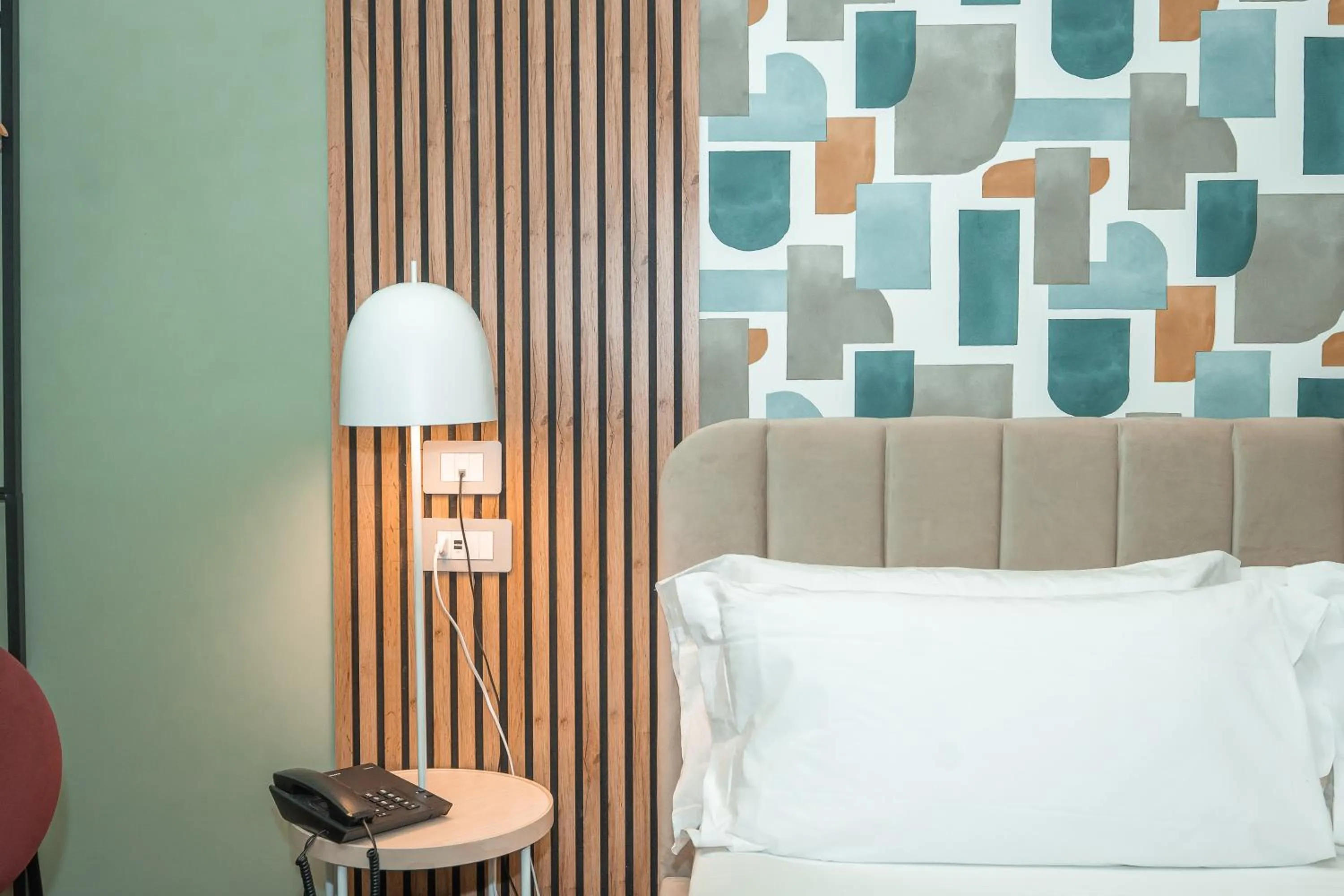 Bed in Noah Gate Hotel & Suites