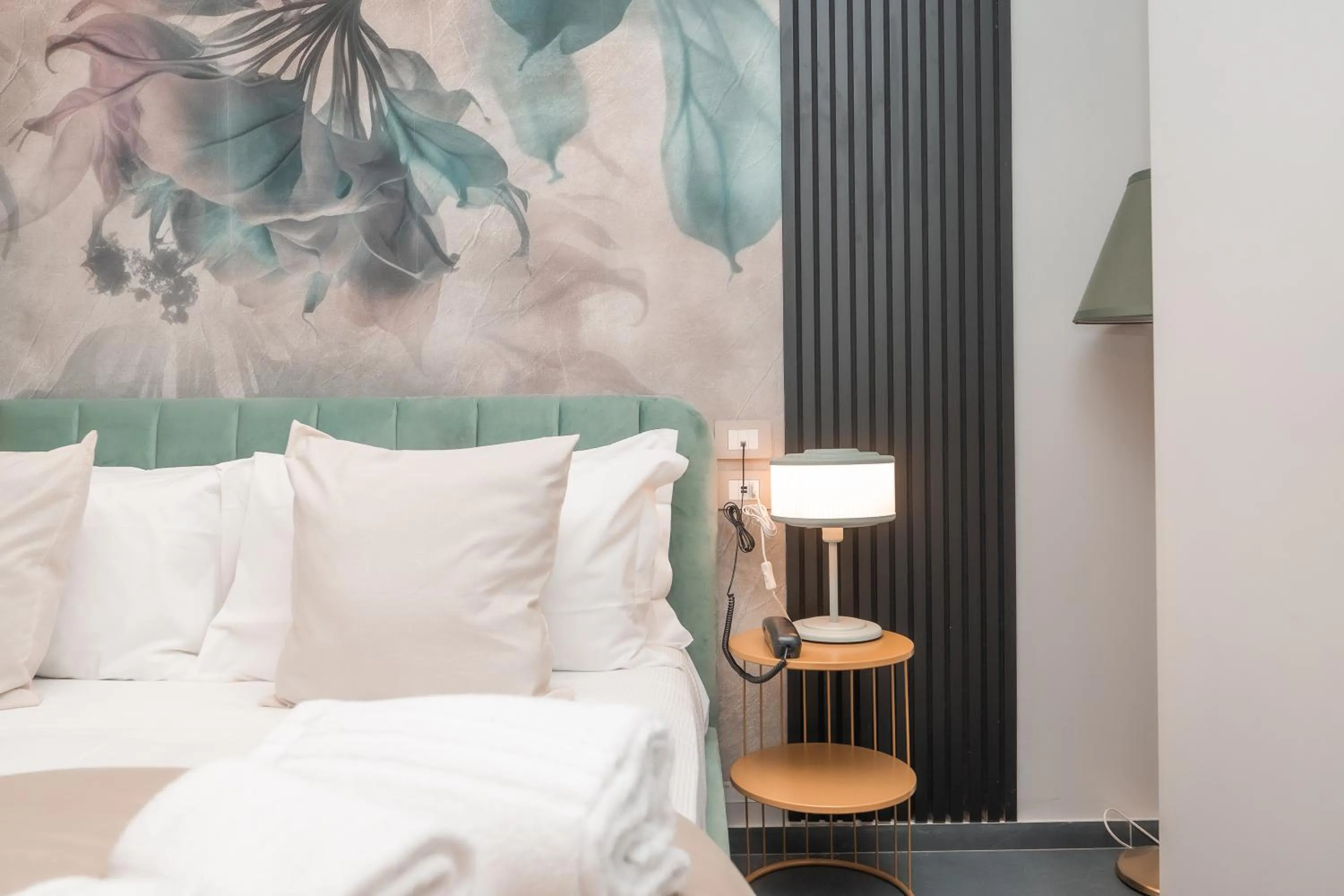 Bed in Noah Gate Hotel & Suites