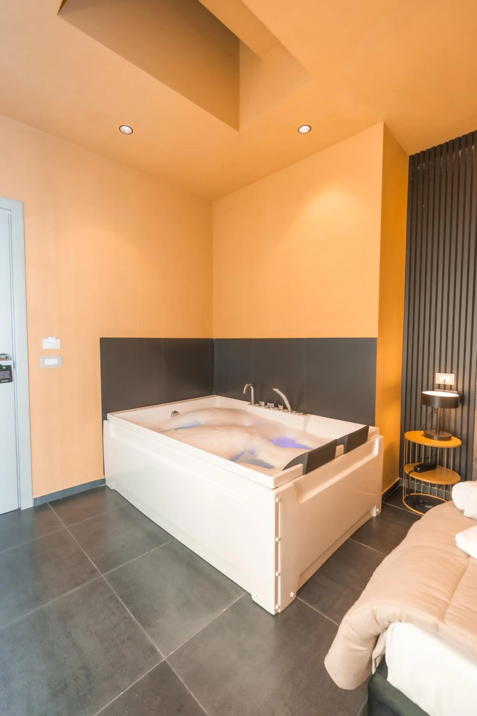 Bed in Noah Gate Hotel & Suites