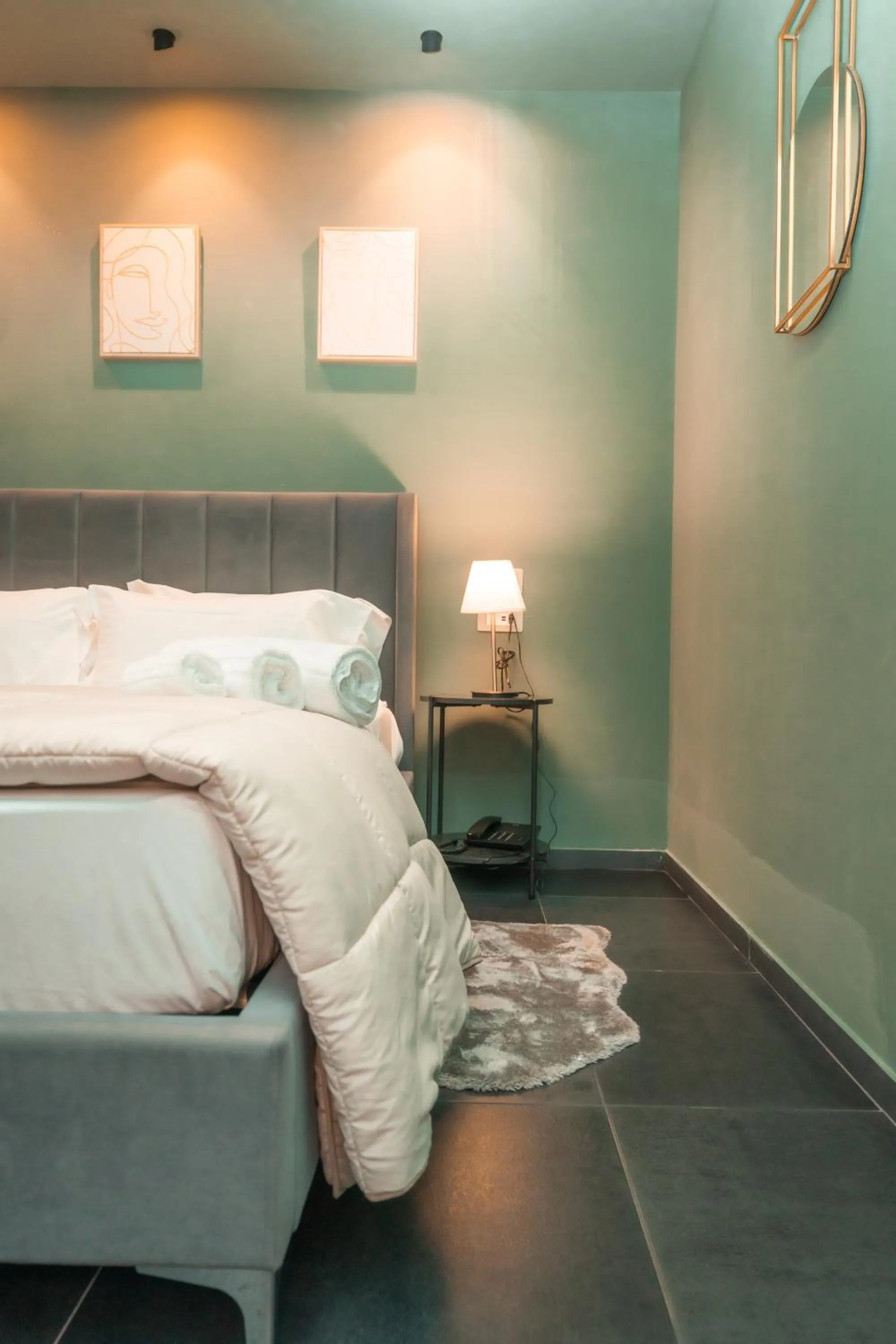 Bed in Noah Gate Hotel & Suites