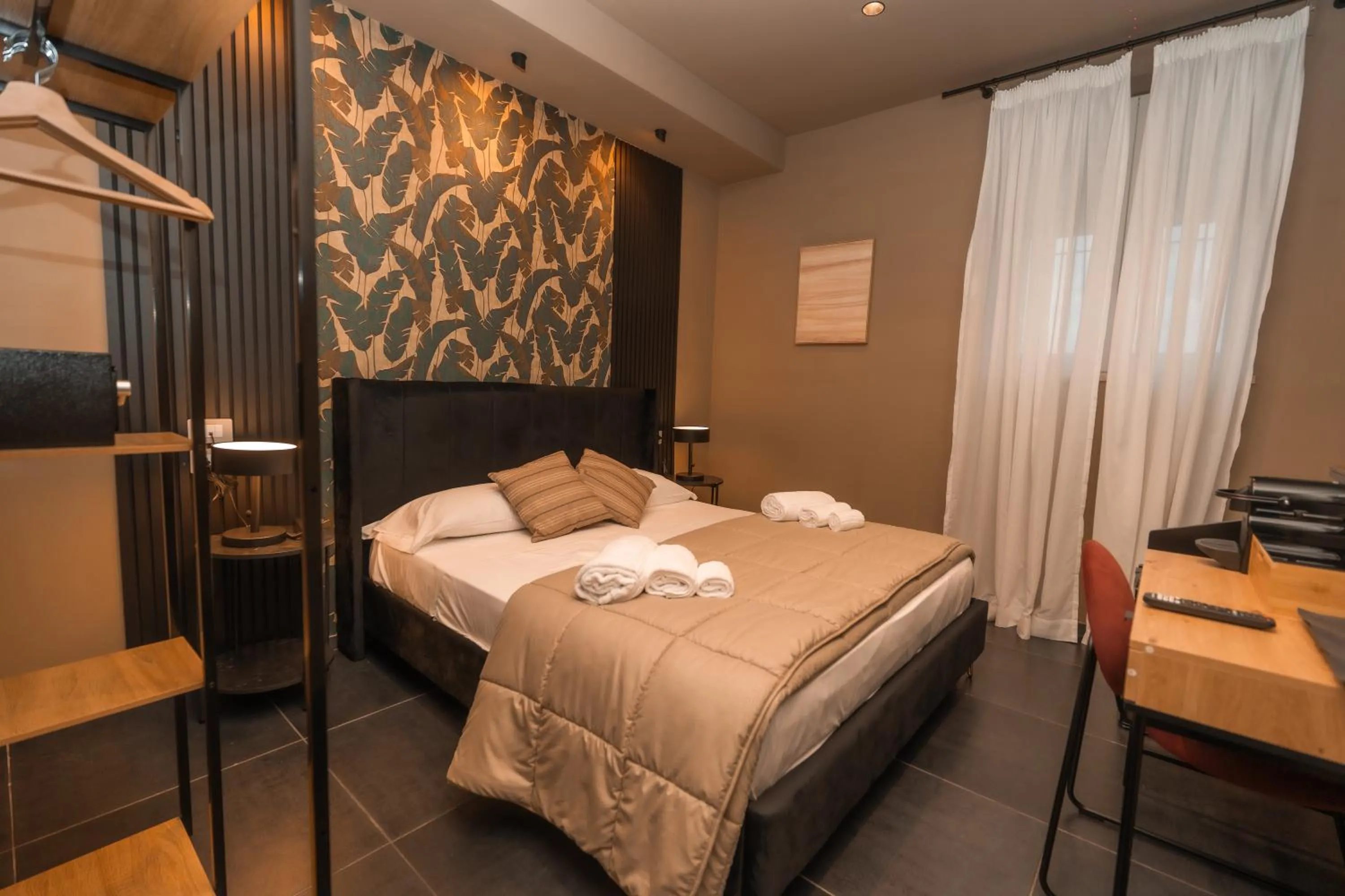 Bed in Noah Gate Hotel & Suites