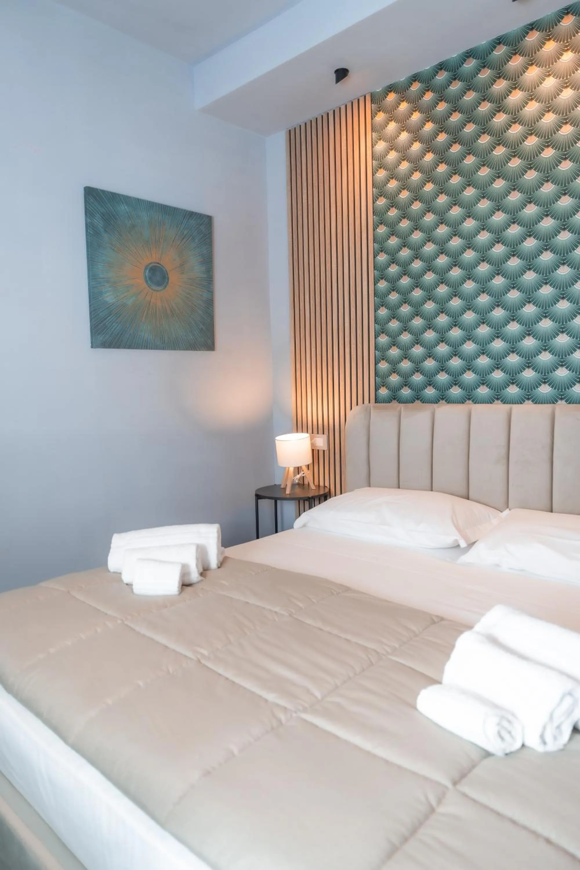 Bed in Noah Gate Hotel & Suites