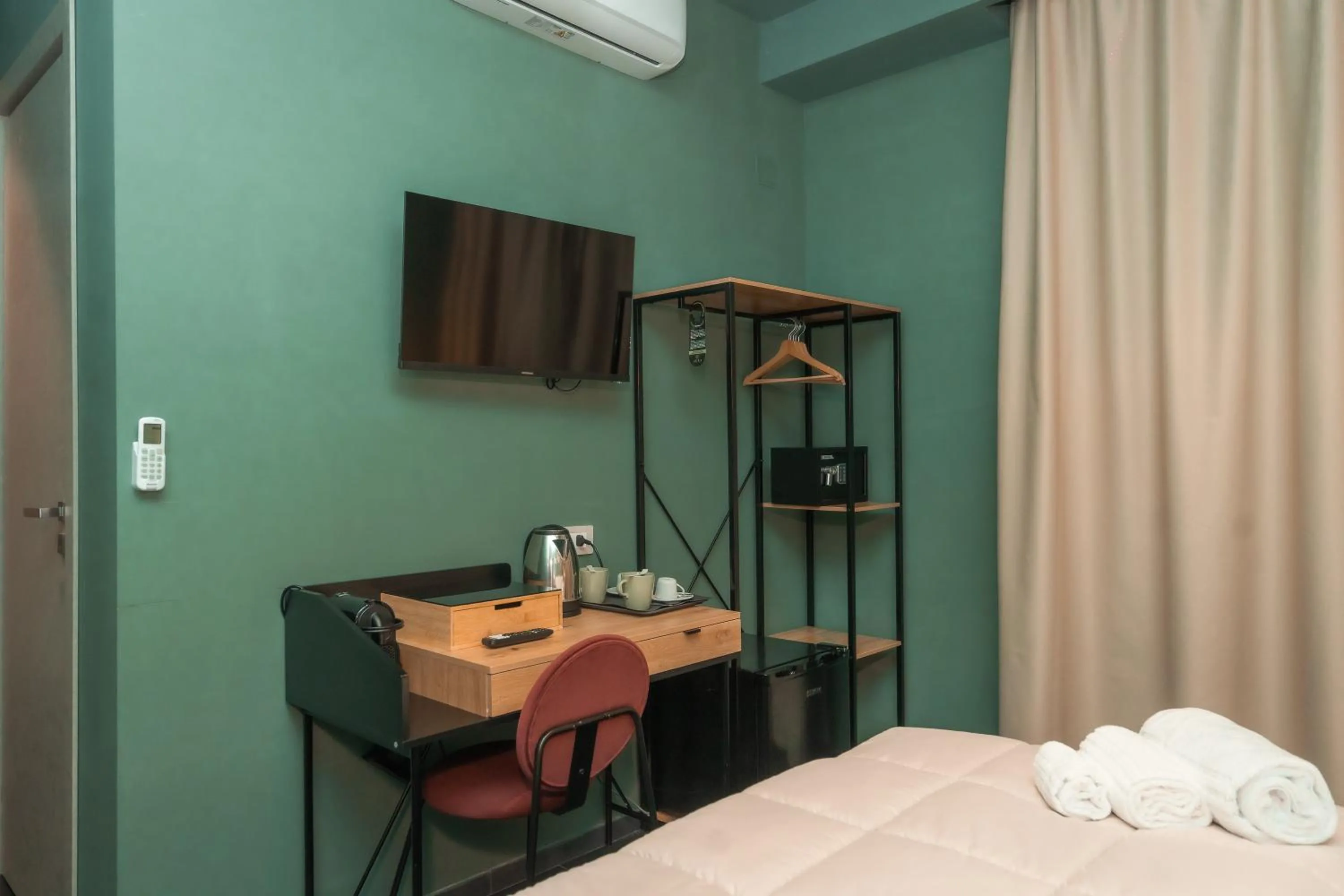 Bed in Noah Gate Hotel & Suites