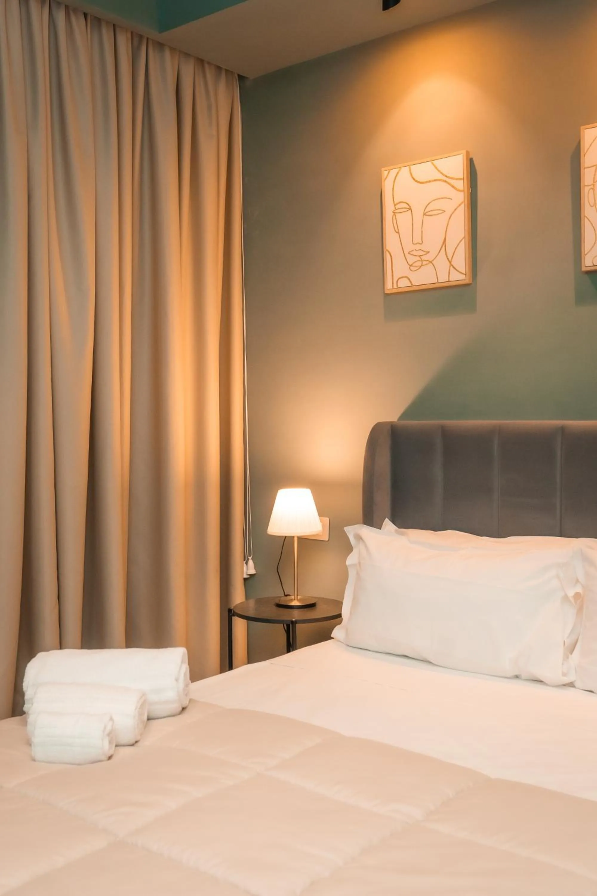 Bed in Noah Gate Hotel & Suites