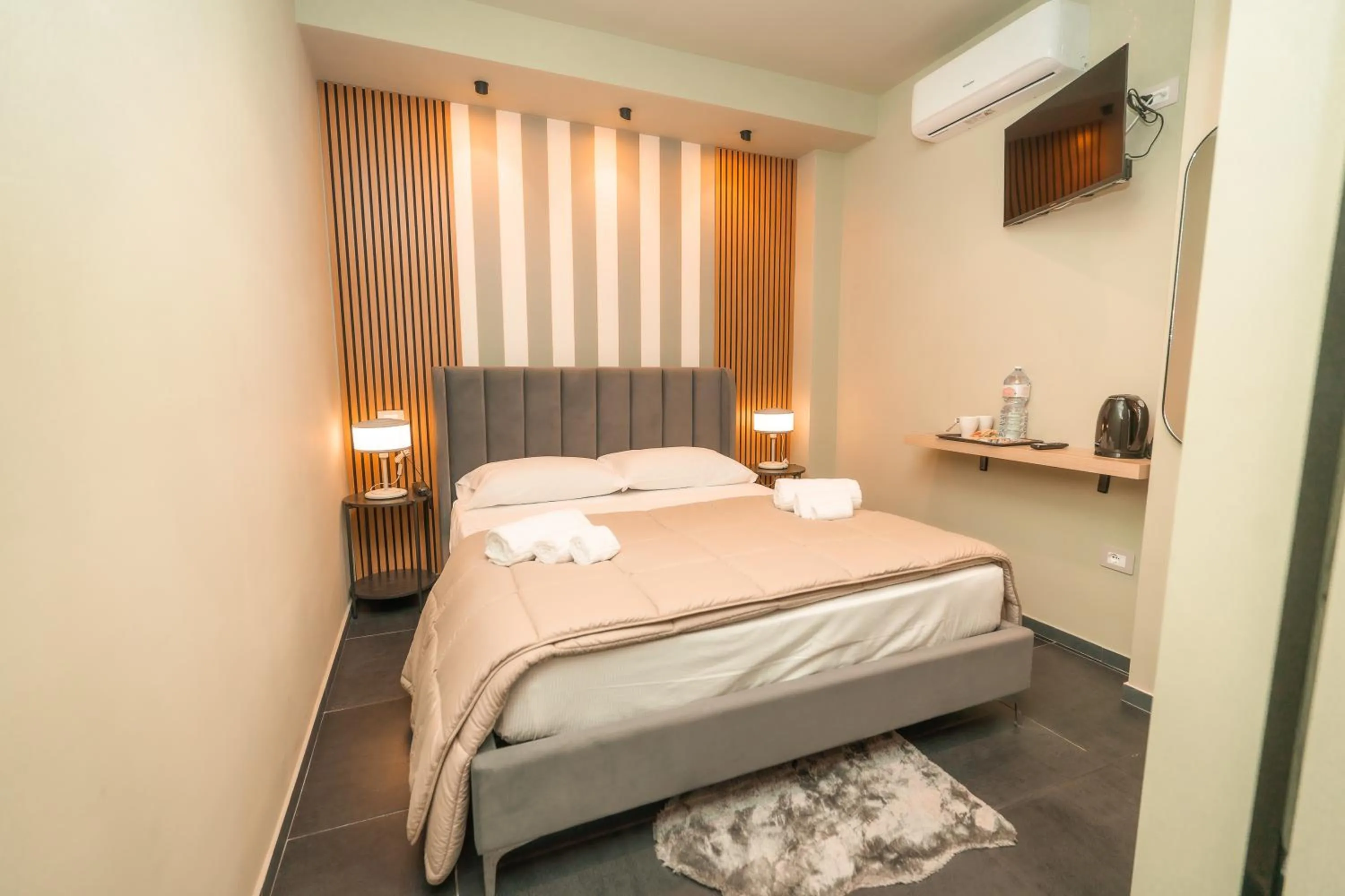 Bed in Noah Gate Hotel & Suites