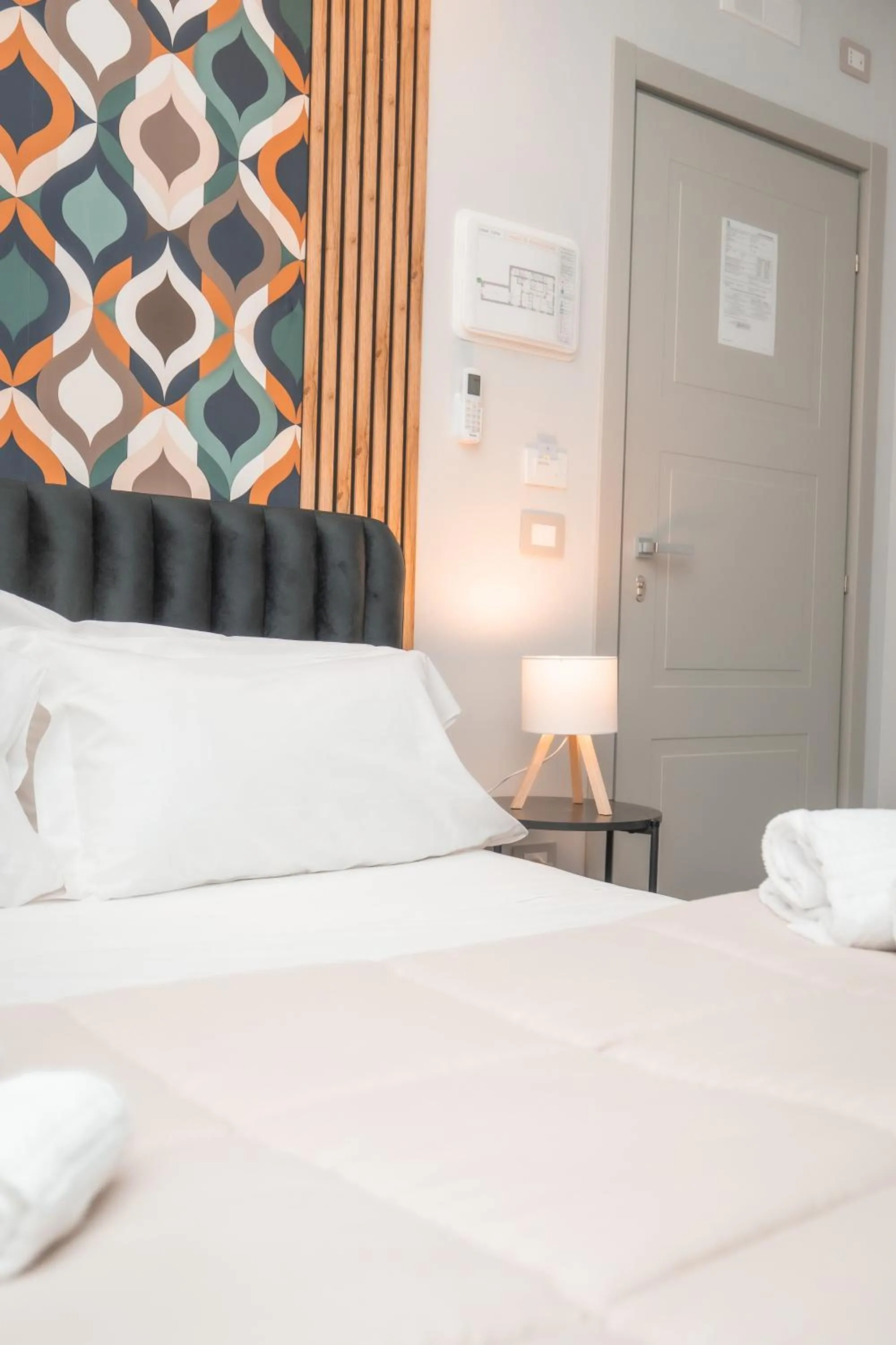 Bed in Noah Gate Hotel & Suites