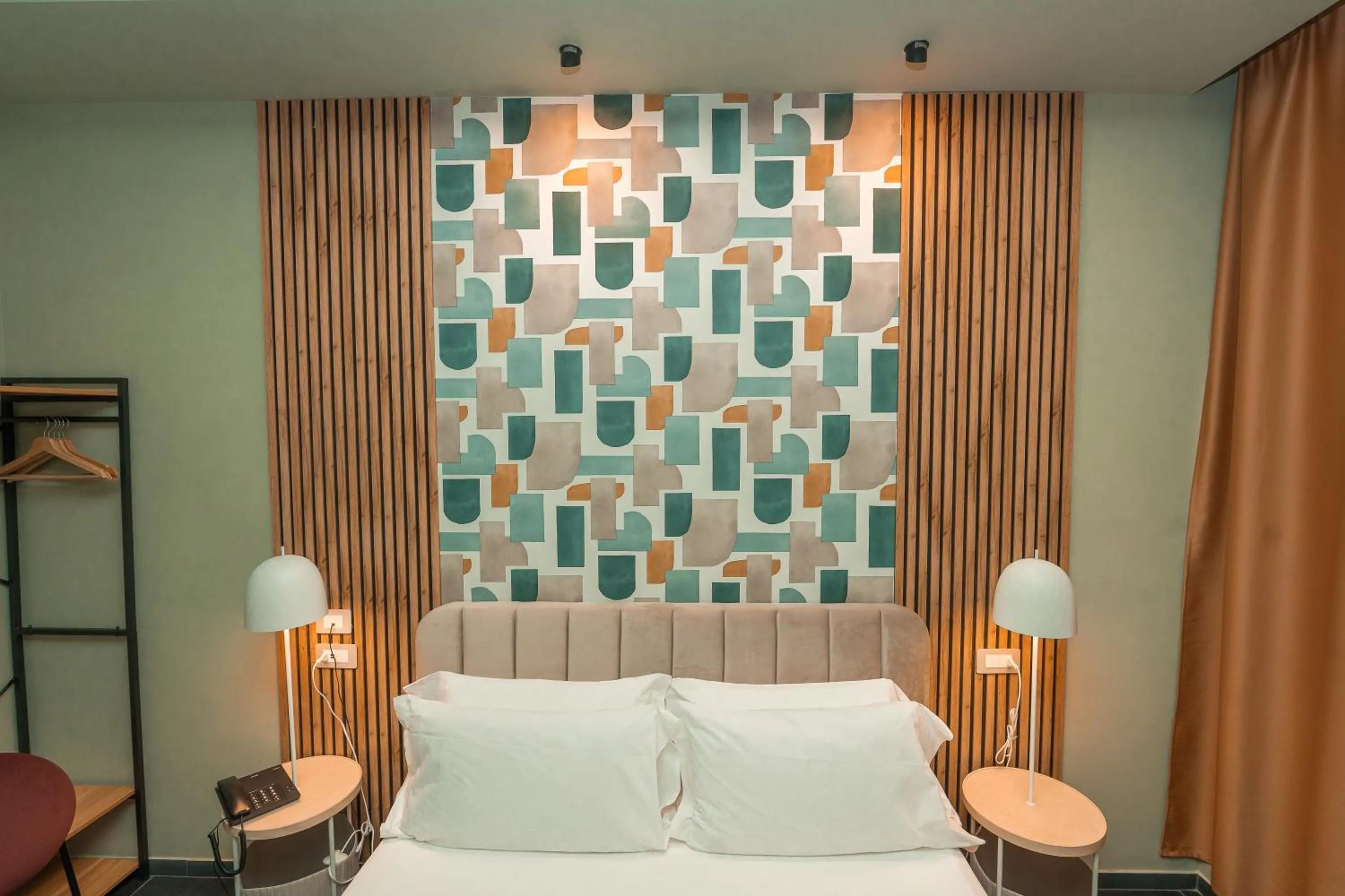 Bed in Noah Gate Hotel & Suites