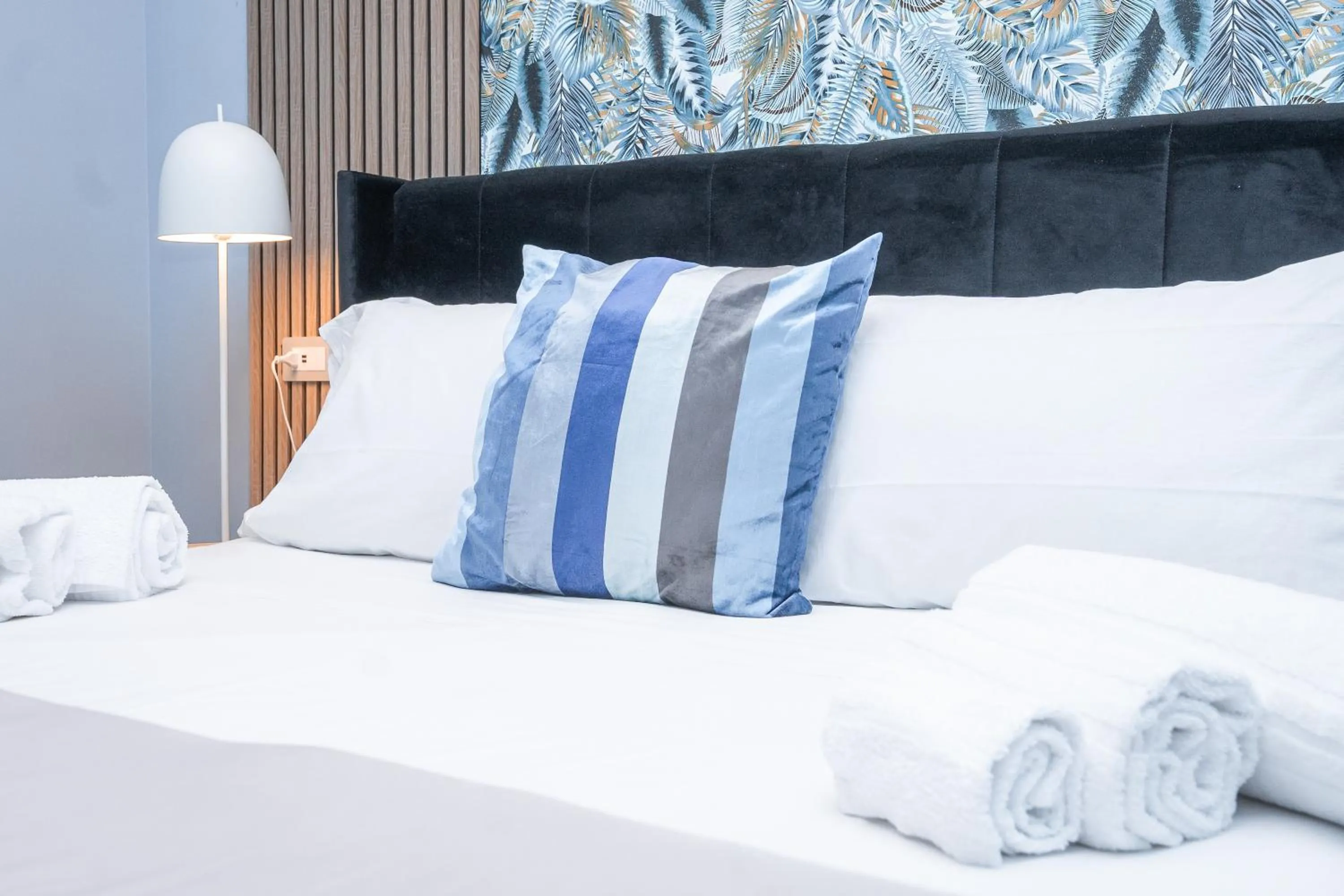 Bed in Noah Gate Hotel & Suites